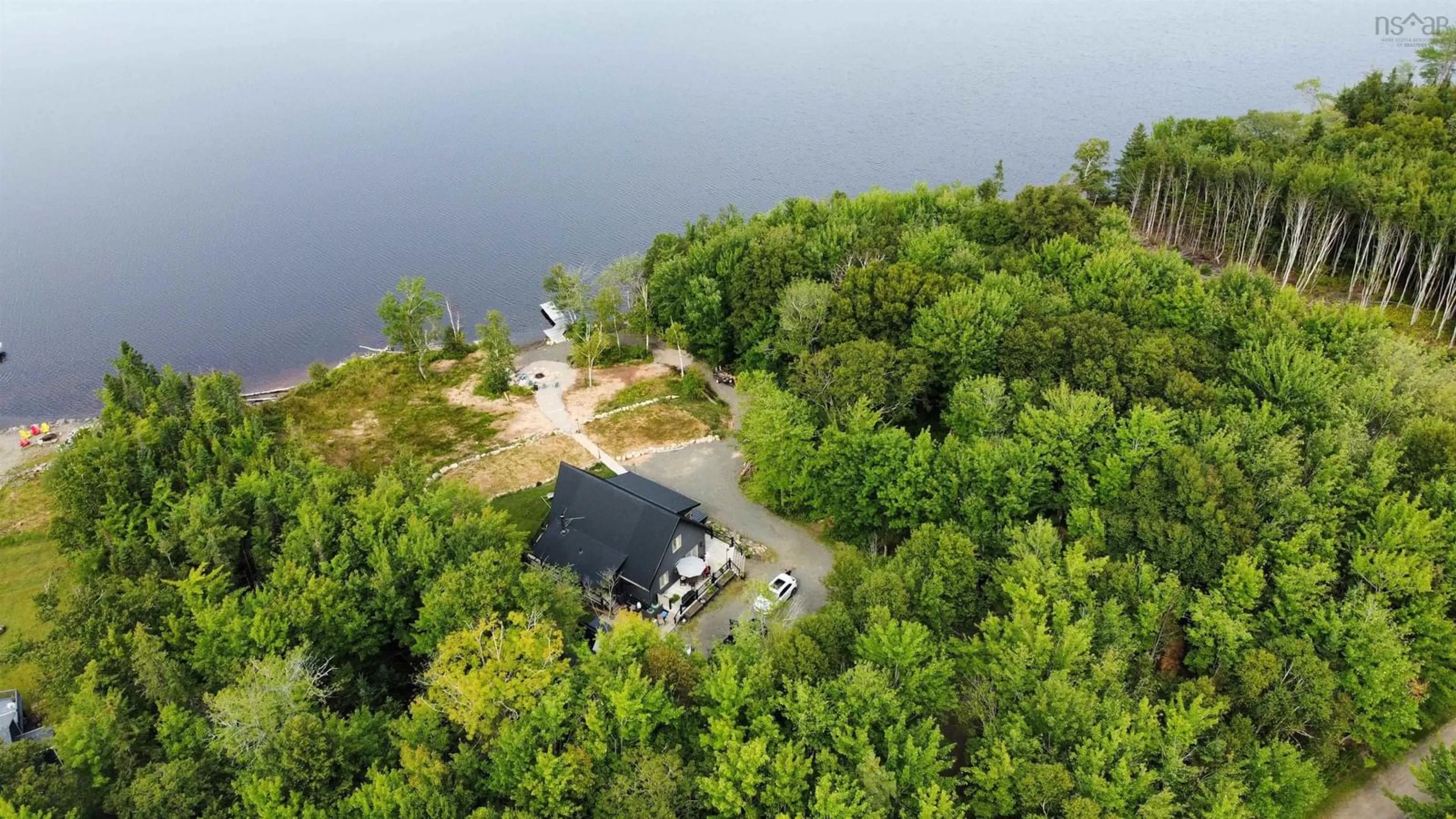 A pic from outside/outdoor area/front of a property/back of a property/a pic from drone, water/lake/river/ocean view for 152 Mersey Rd, Inlet Baddeck Nova Scotia B0E 1B0