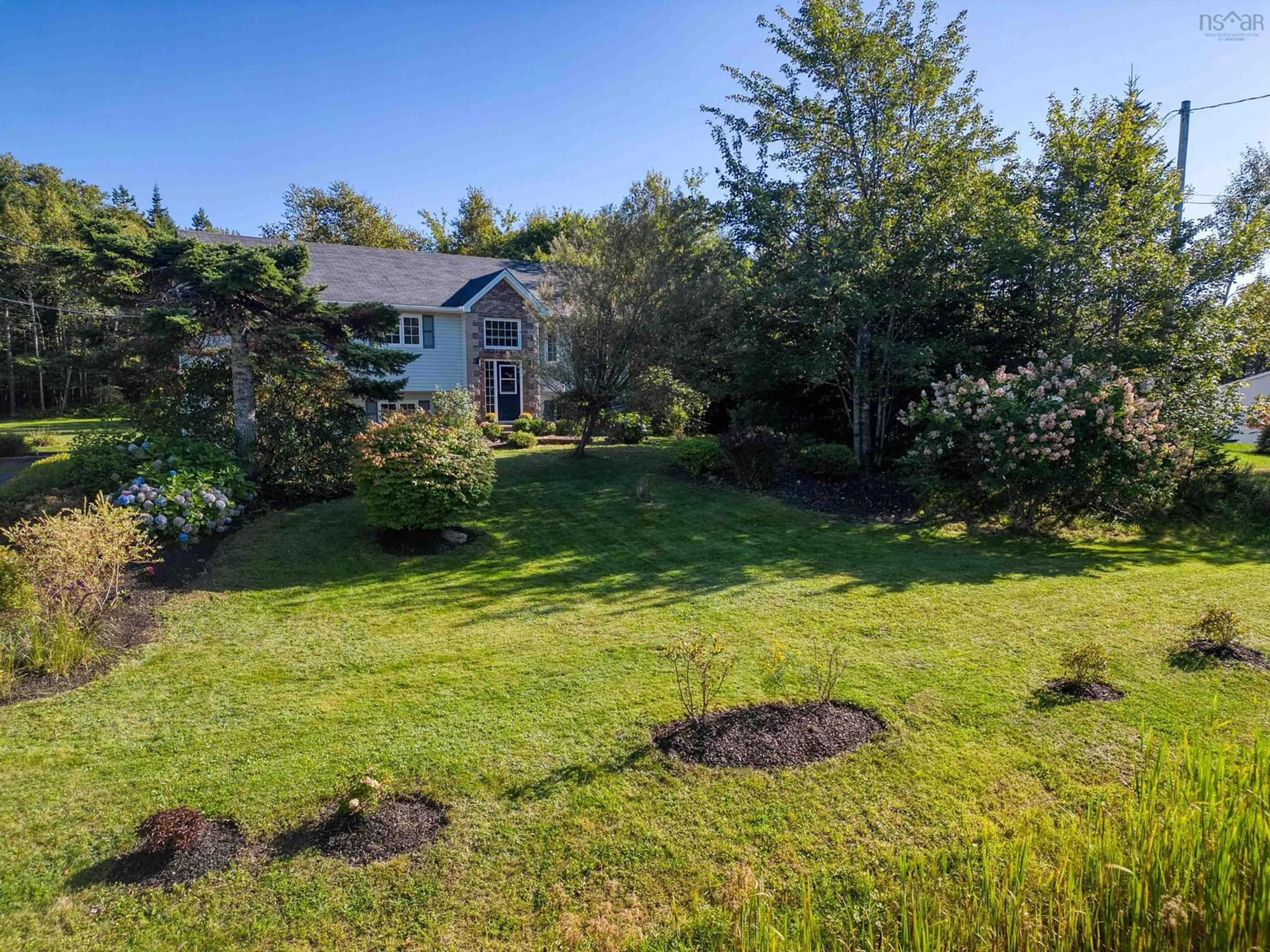 Frontside or backside of a home, the fenced backyard for 411 Kingswood Dr, Hammonds Plains Nova Scotia B4B 1M2