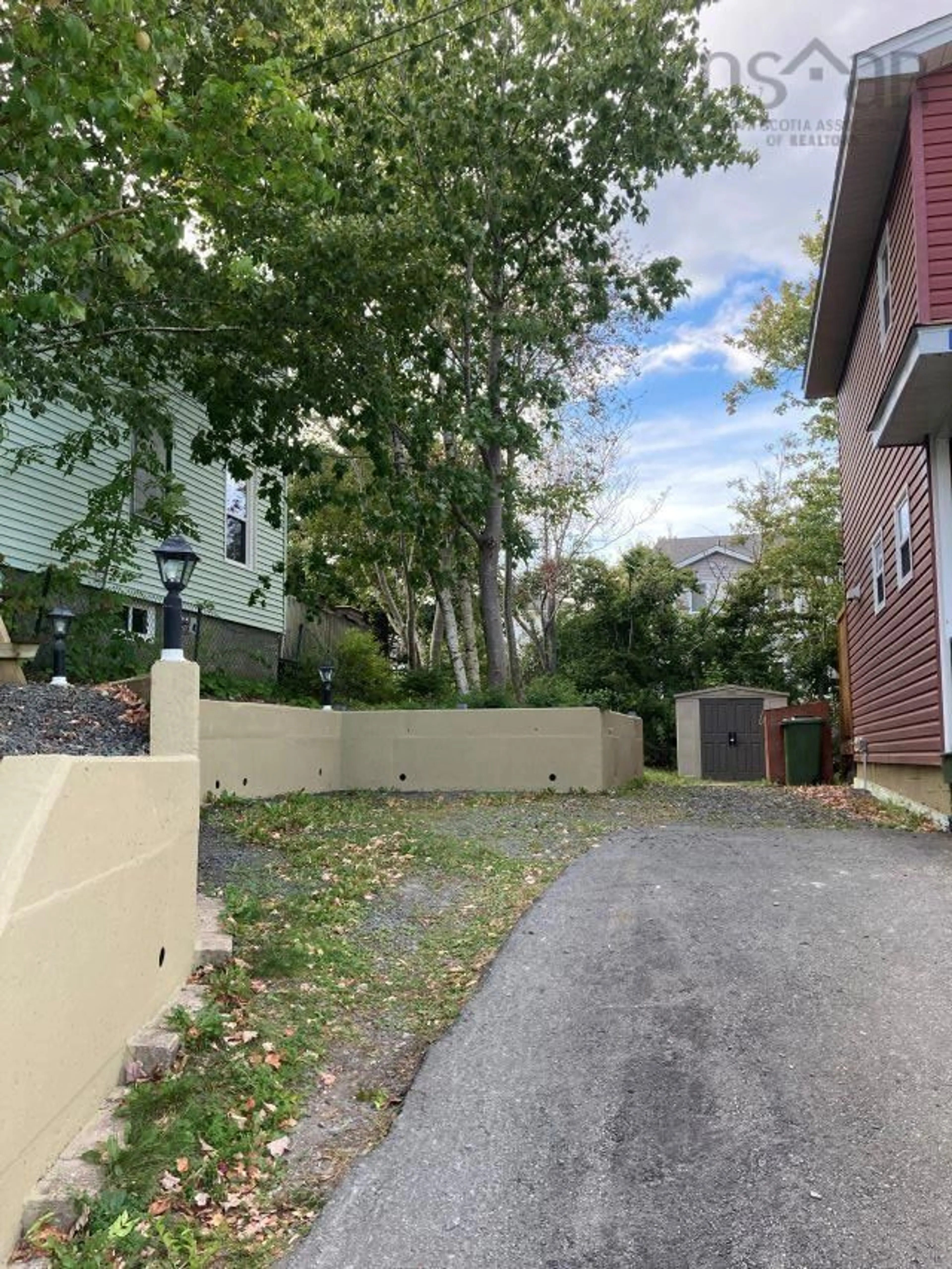 A pic from exterior of the house or condo, the fenced backyard for 41 Coronation Ave, Halifax Nova Scotia B3N 2M5