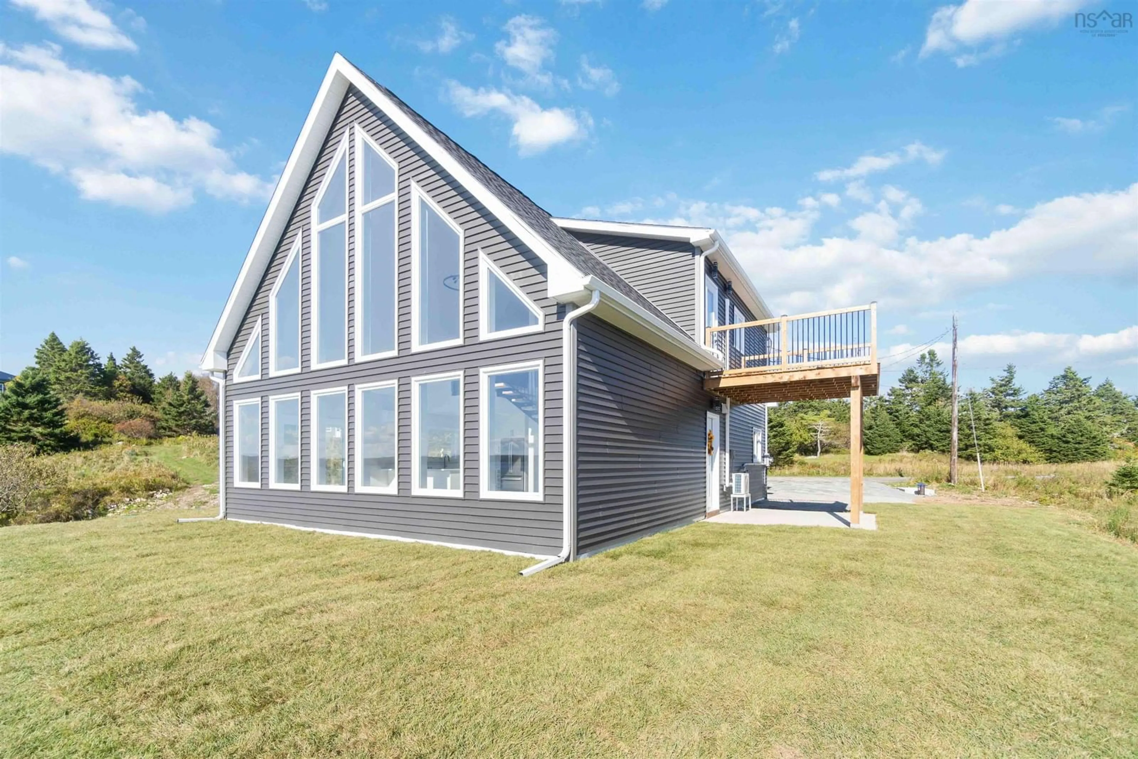 Home with vinyl exterior material for 23 Williams Rd, Ostrea Lake Nova Scotia B0J 2L0