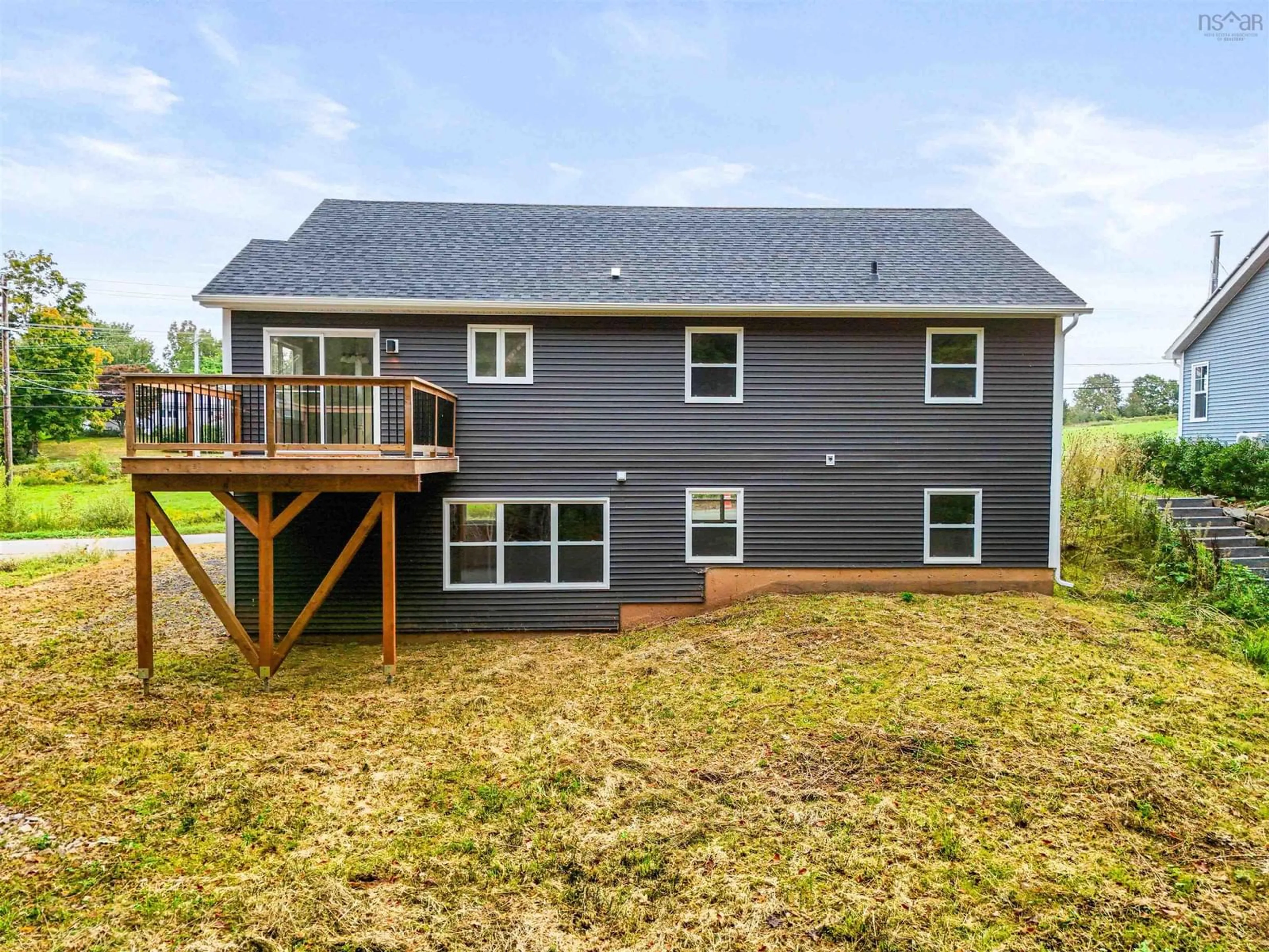 Frontside or backside of a home, the fenced backyard for 136 Maple Ave, Wolfville Nova Scotia B4P 2L9