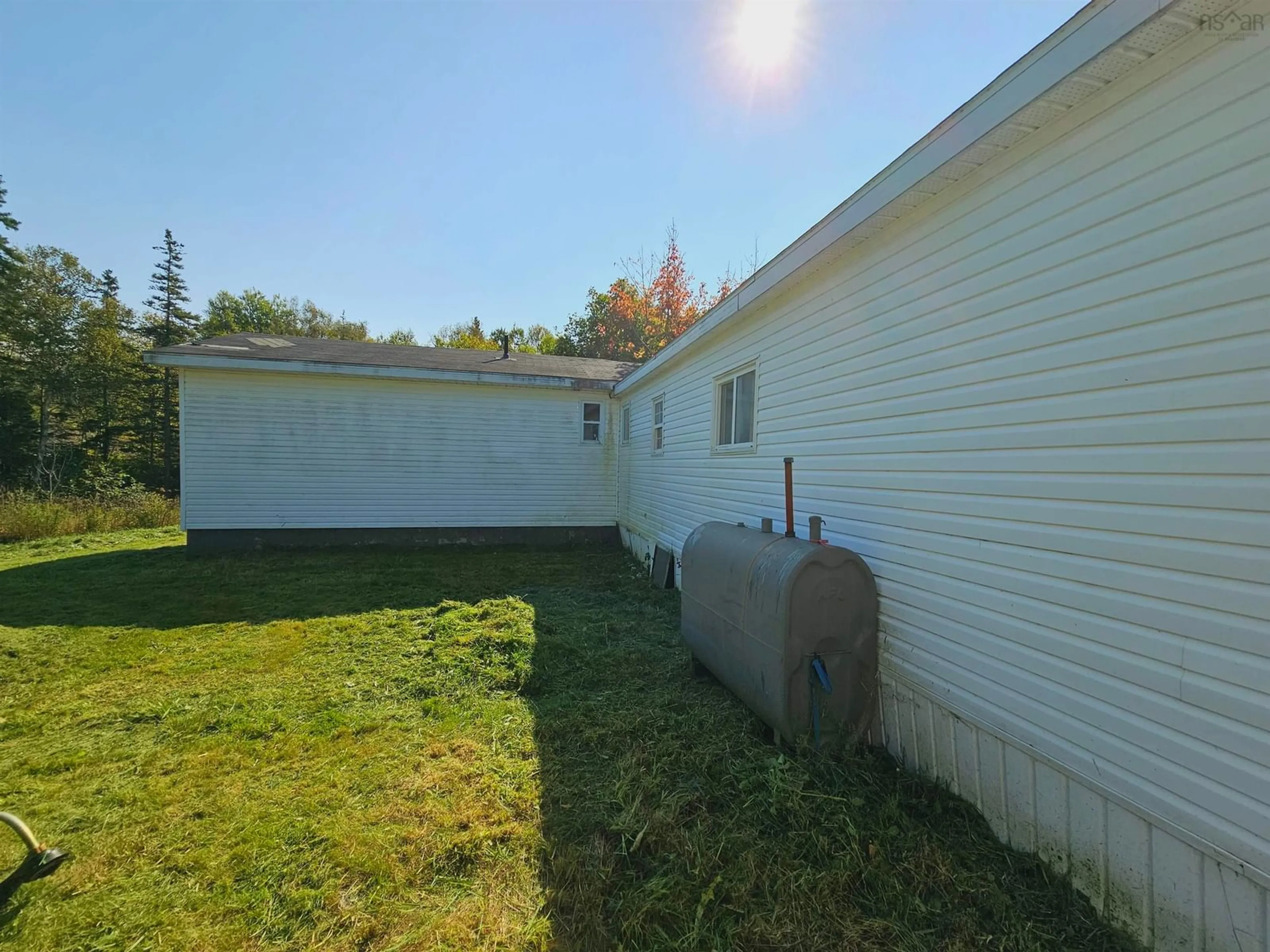 Frontside or backside of a home, the fenced backyard for 906 Point Aconi Rd, Point Aconi Nova Scotia B1Y 1Z9