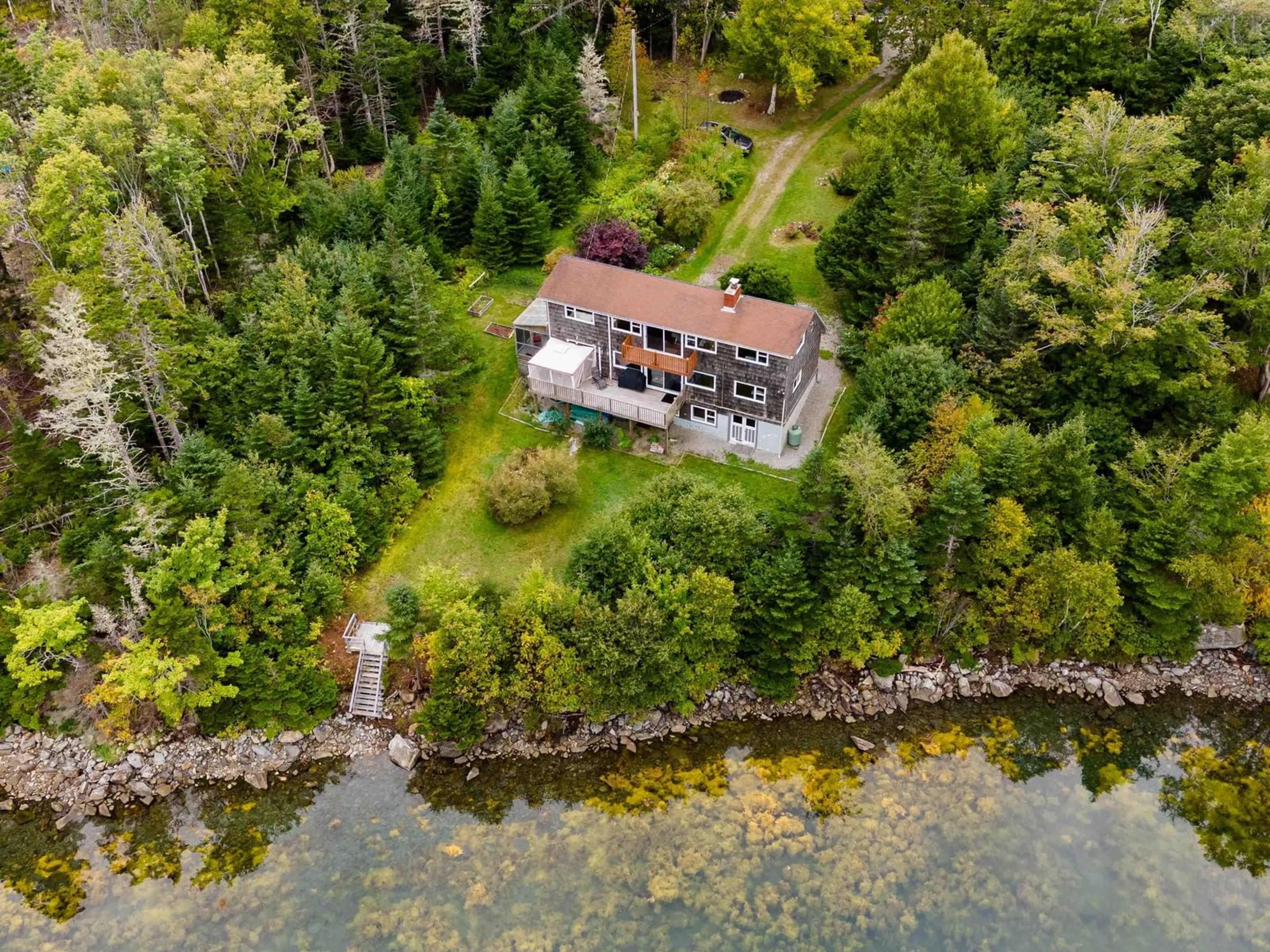 A pic from outside/outdoor area/front of a property/back of a property/a pic from drone, water/lake/river/ocean view for 516 Highway 308, Morris Island Nova Scotia B0W 3M0