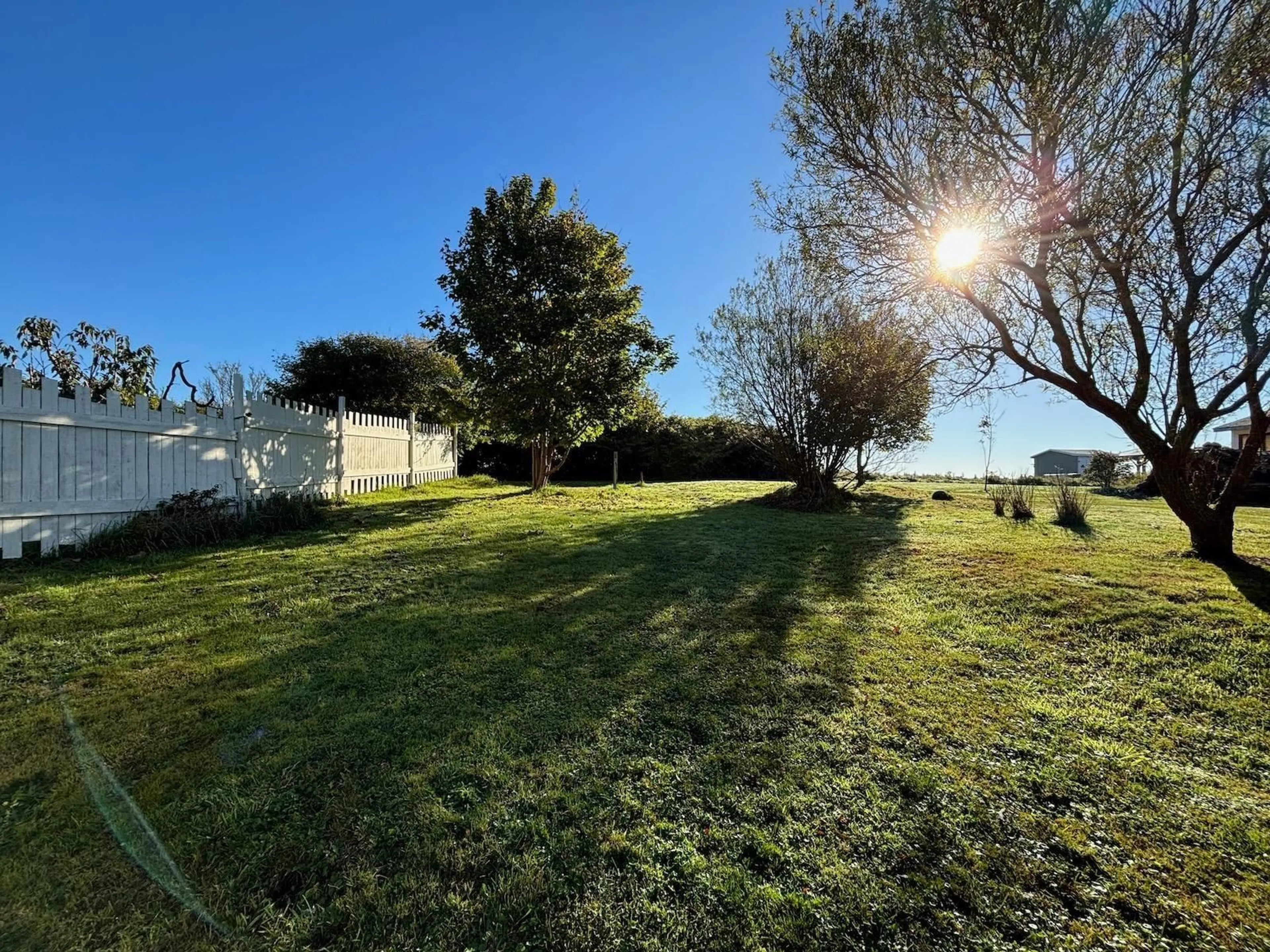 A pic from exterior of the house or condo, the fenced backyard for 16 Regent St, Yarmouth Nova Scotia B5A 2L3