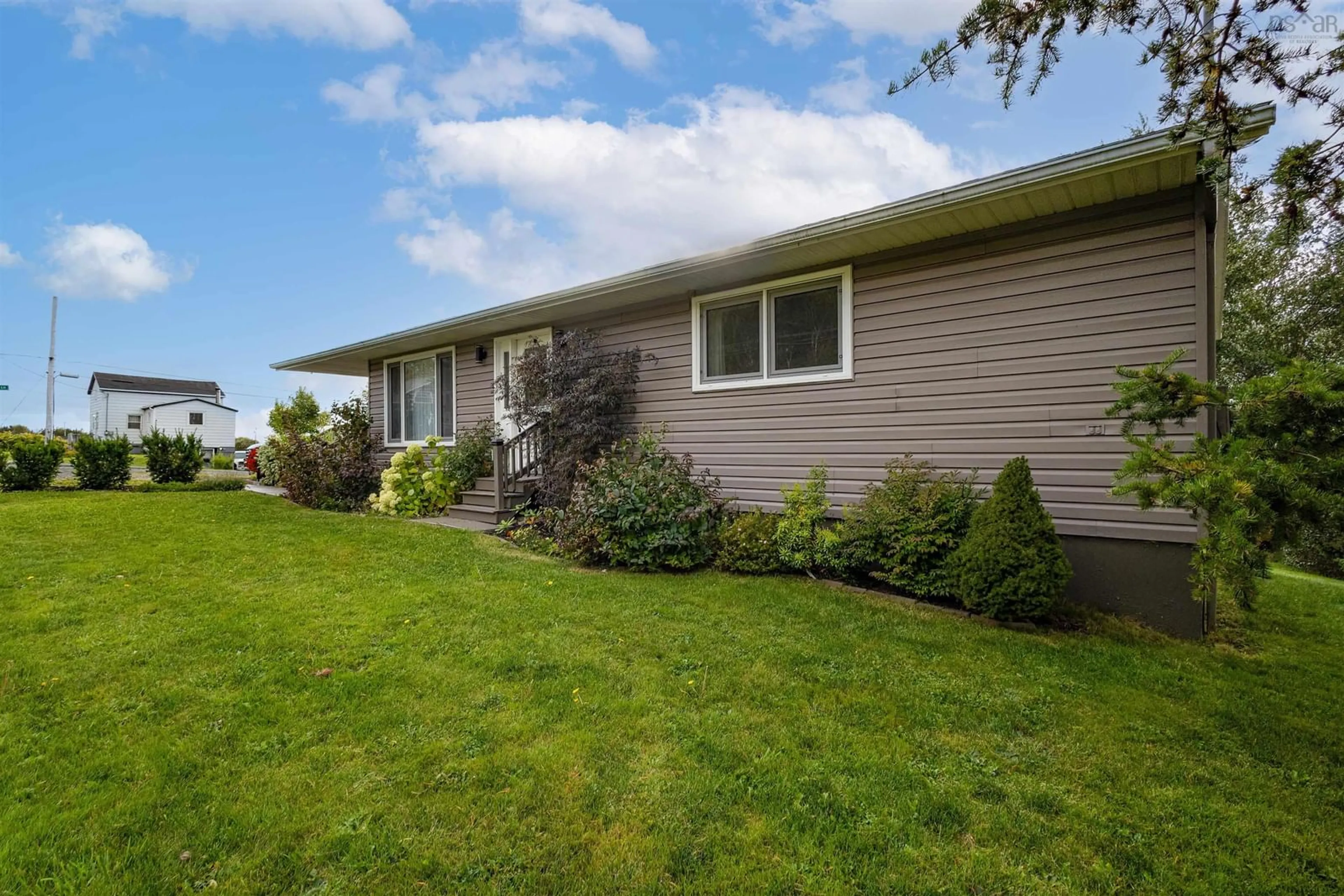 Frontside or backside of a home, the fenced backyard for 2295 Highway 28, South Bar Nova Scotia B1N 3H8