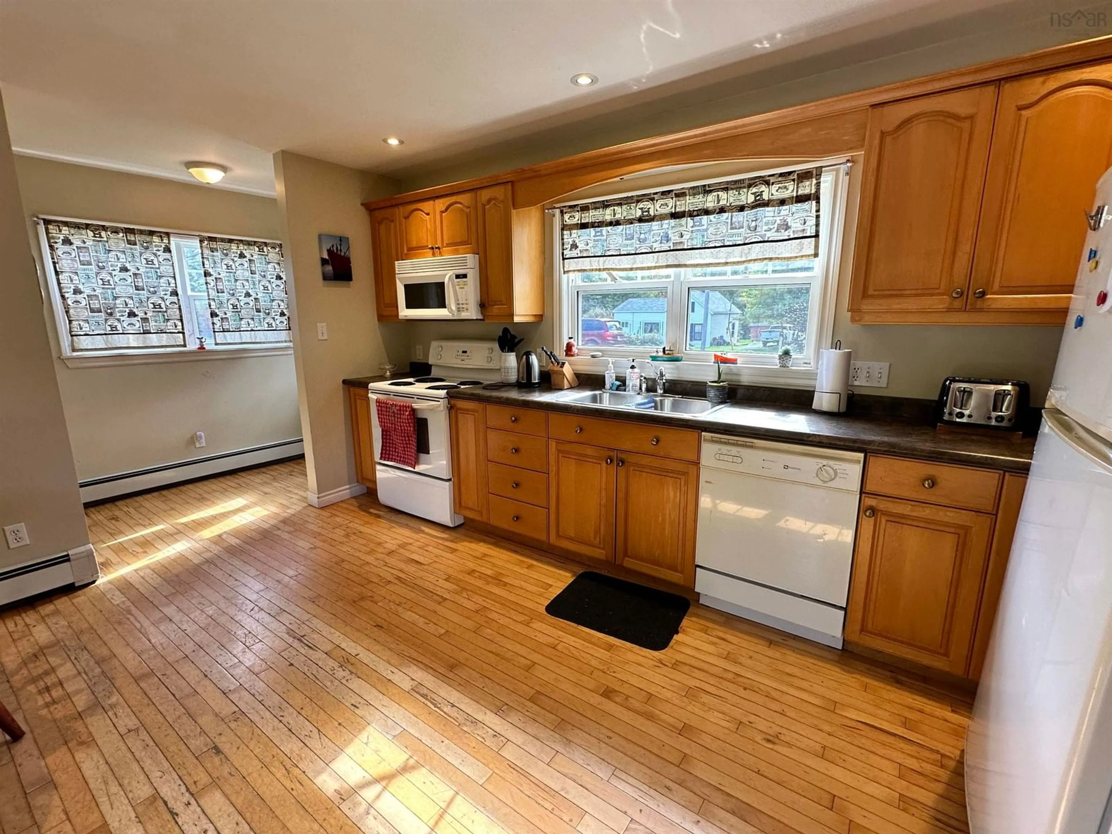 Standard kitchen, wood floors, cottage for 23 Highway 8, Milton Nova Scotia B0T 1P0