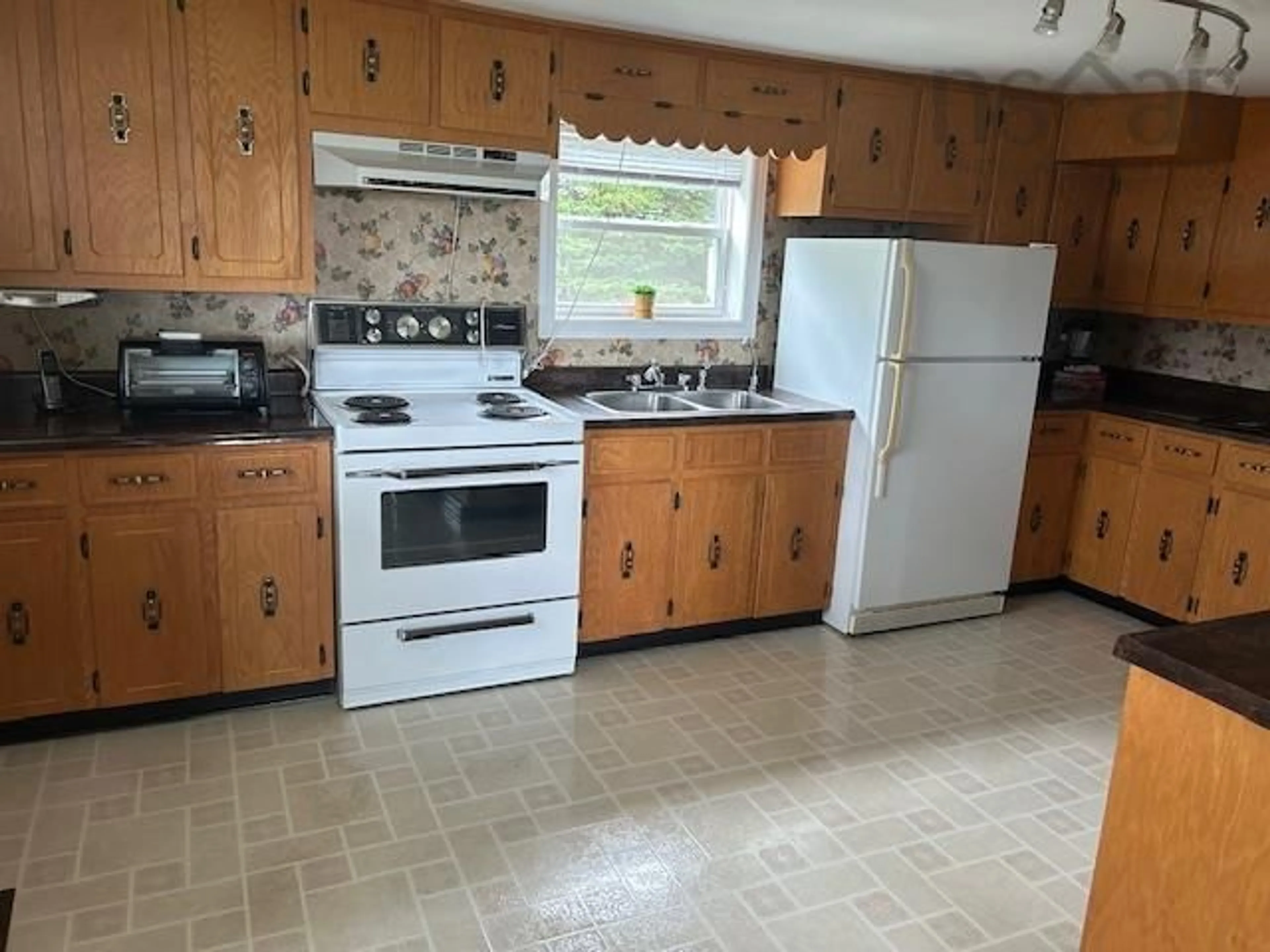 Standard kitchen, wood floors, cottage for 98 Cove Rd, West Arichat Nova Scotia B0E 3J0