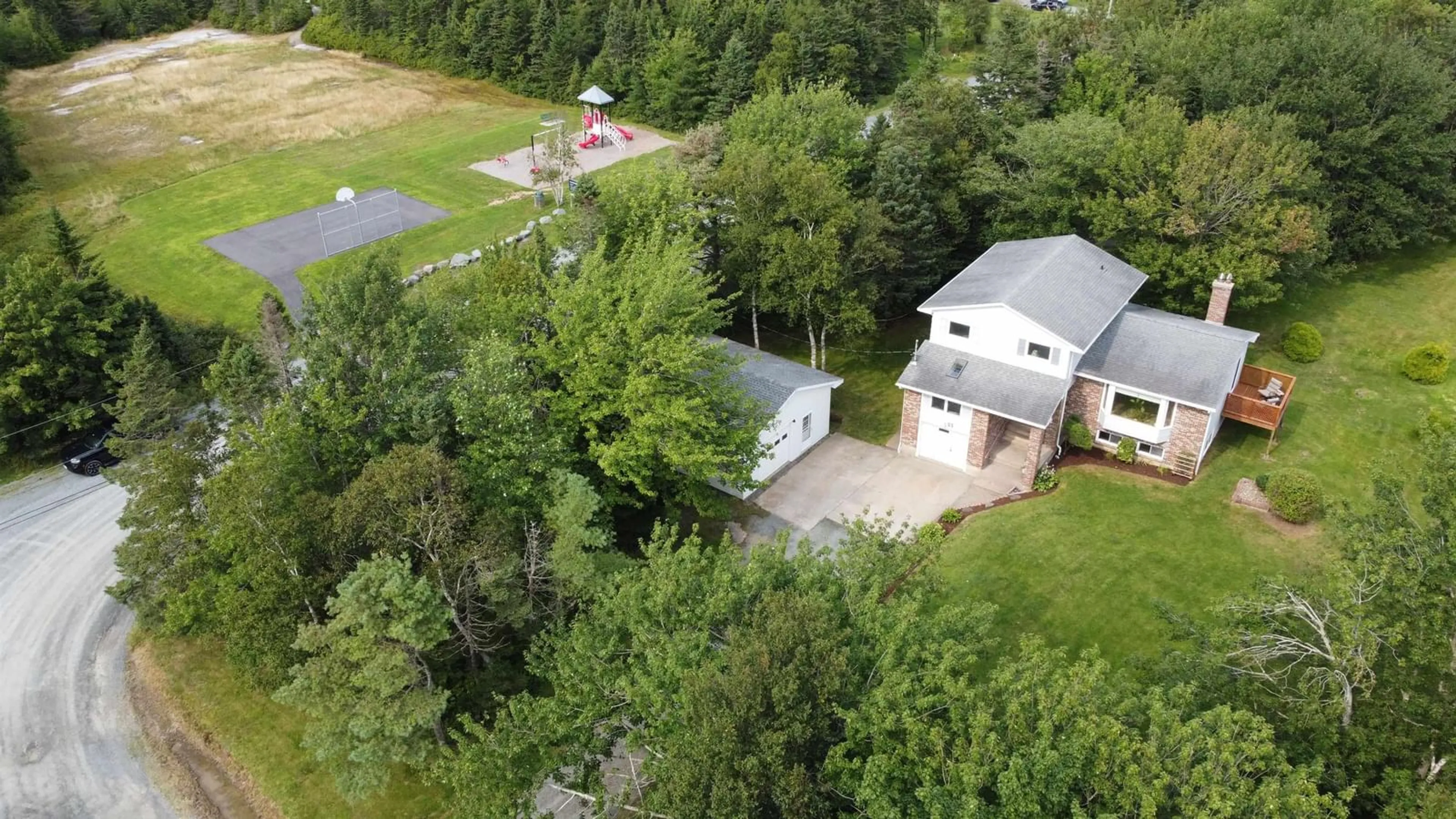 A pic from exterior of the house or condo, the fenced backyard for 23 Frederick Dr, Cow Bay Nova Scotia B3G 1K3