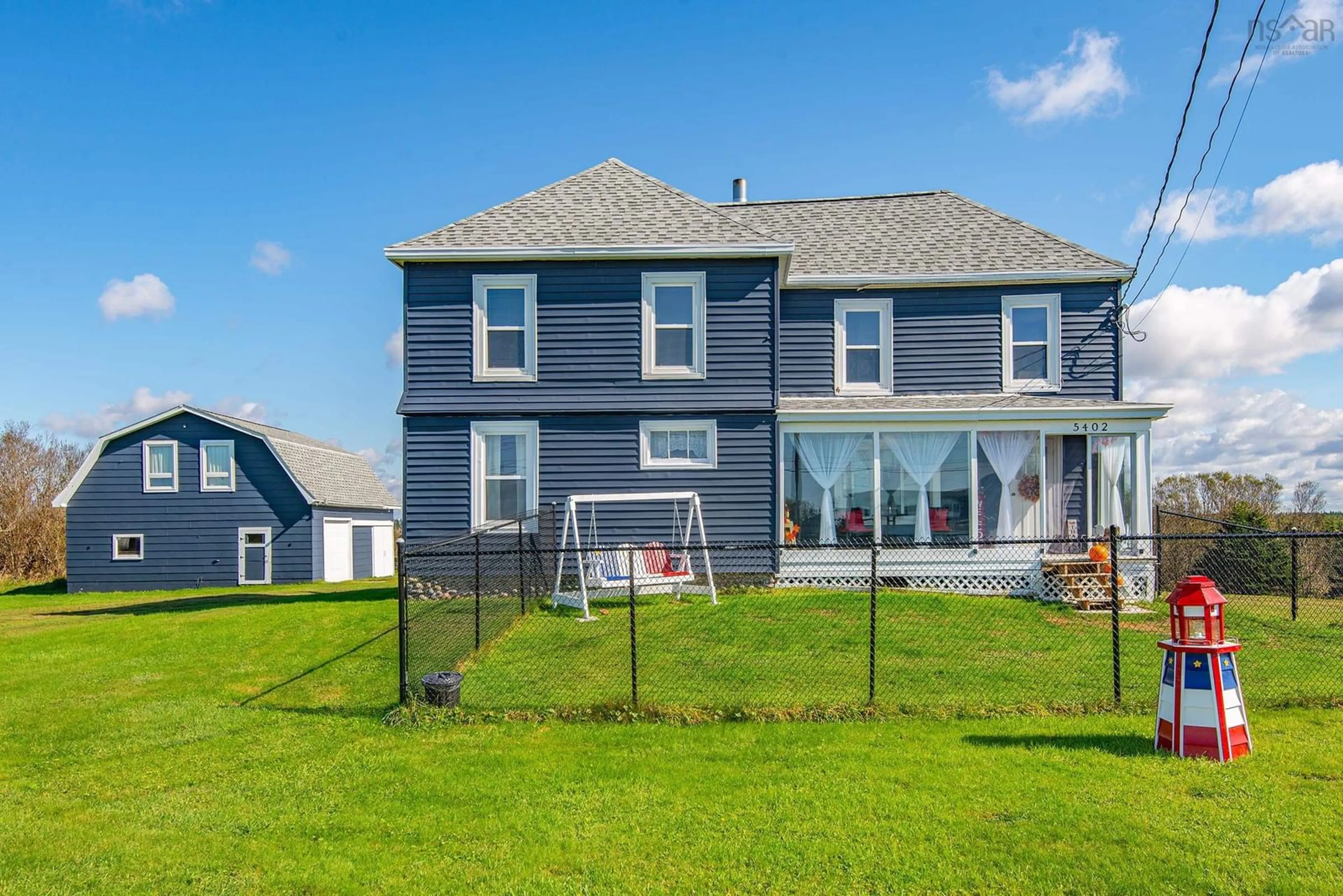 Frontside or backside of a home, the fenced backyard for 5402 Highway 1, Salmon River Nova Scotia B5A 5B3