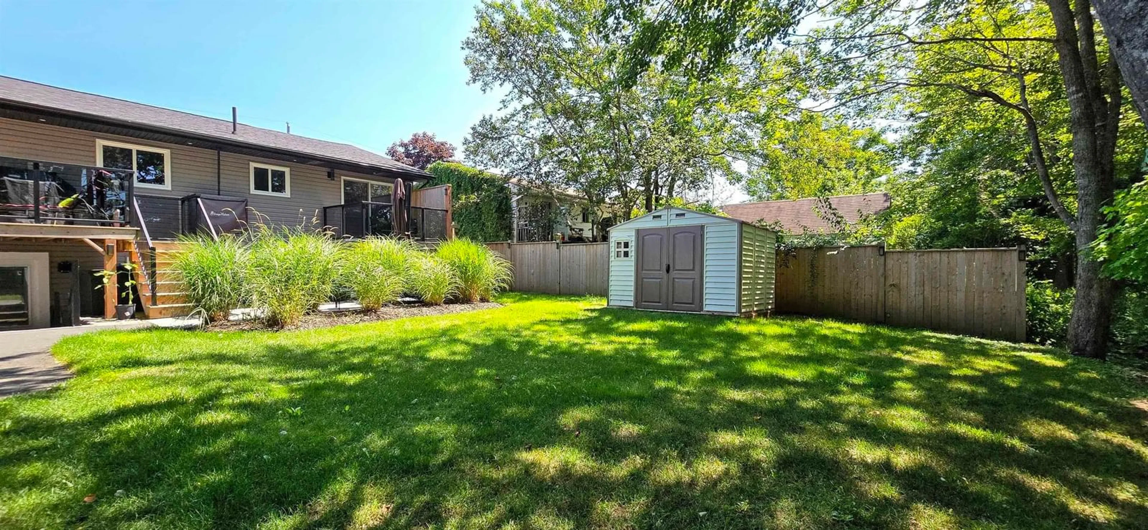 Frontside or backside of a home, the fenced backyard for 50 Johnson Cres, Lower Sackville Nova Scotia B4C 3A4