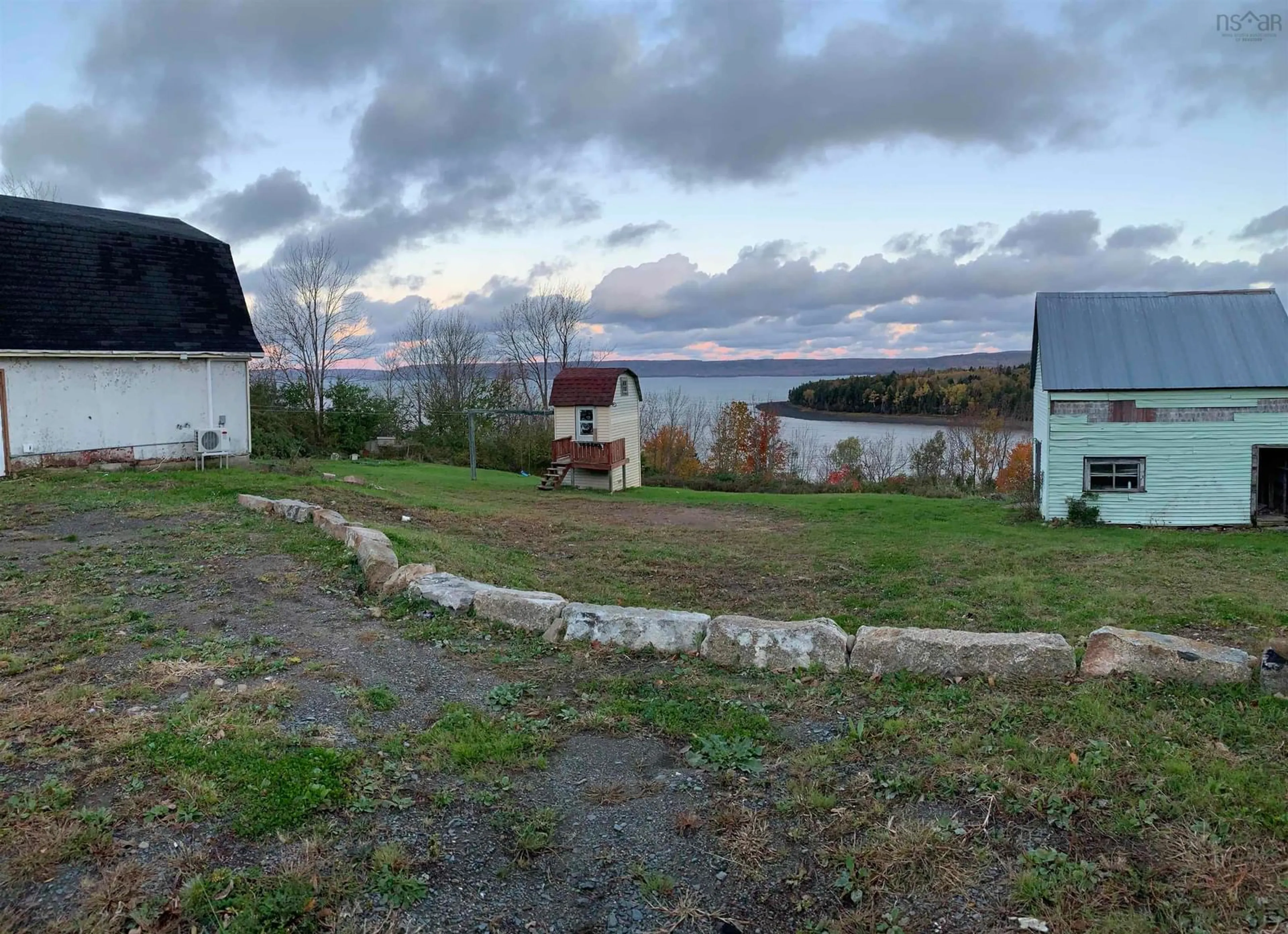 Frontside or backside of a home, the fenced backyard for 1421 Highway 1, Clementsport Nova Scotia B0S 1E0