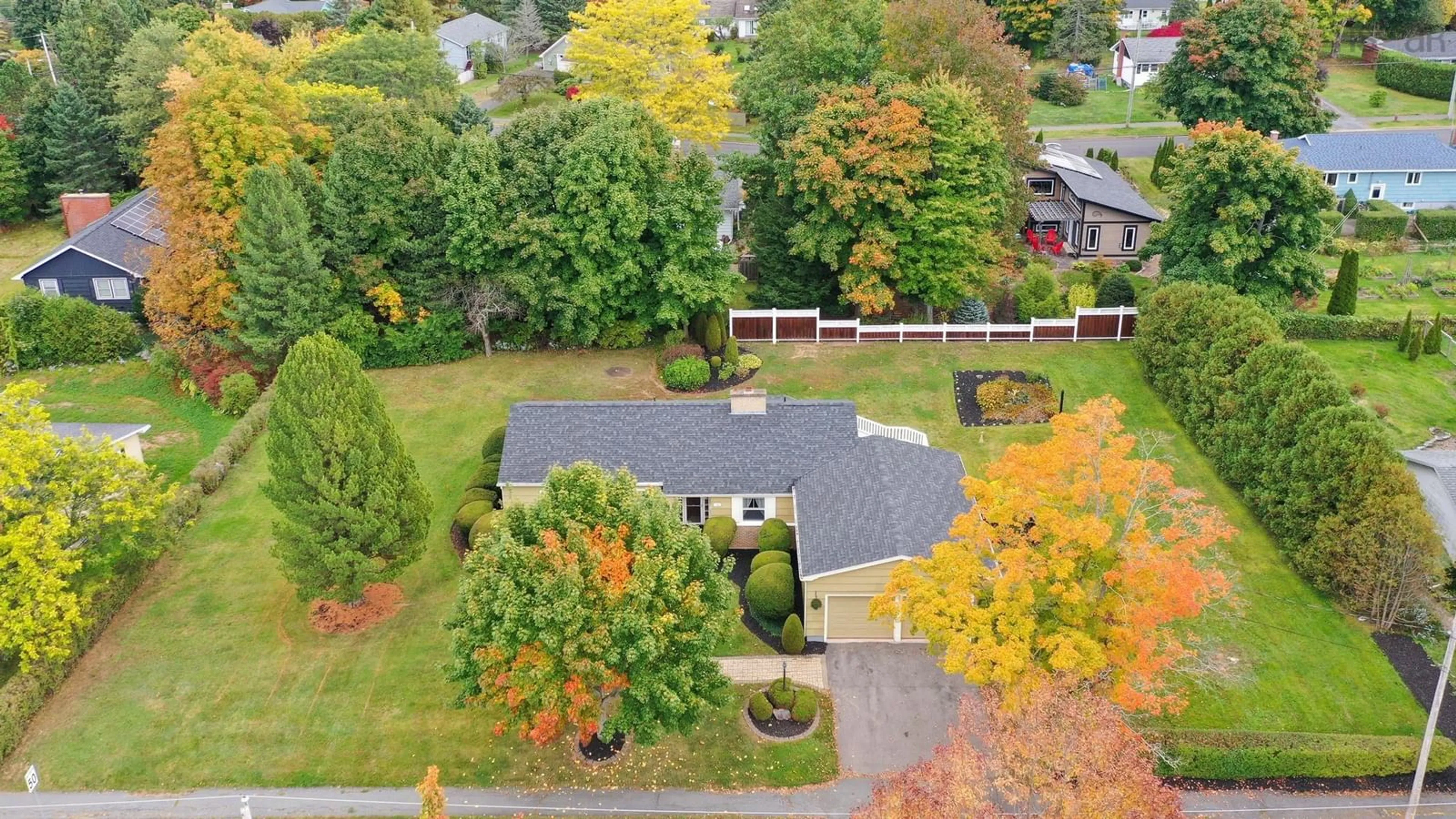 A pic from exterior of the house or condo, the fenced backyard for 55 Kent Ave, Wolfville Nova Scotia B4P 1V8