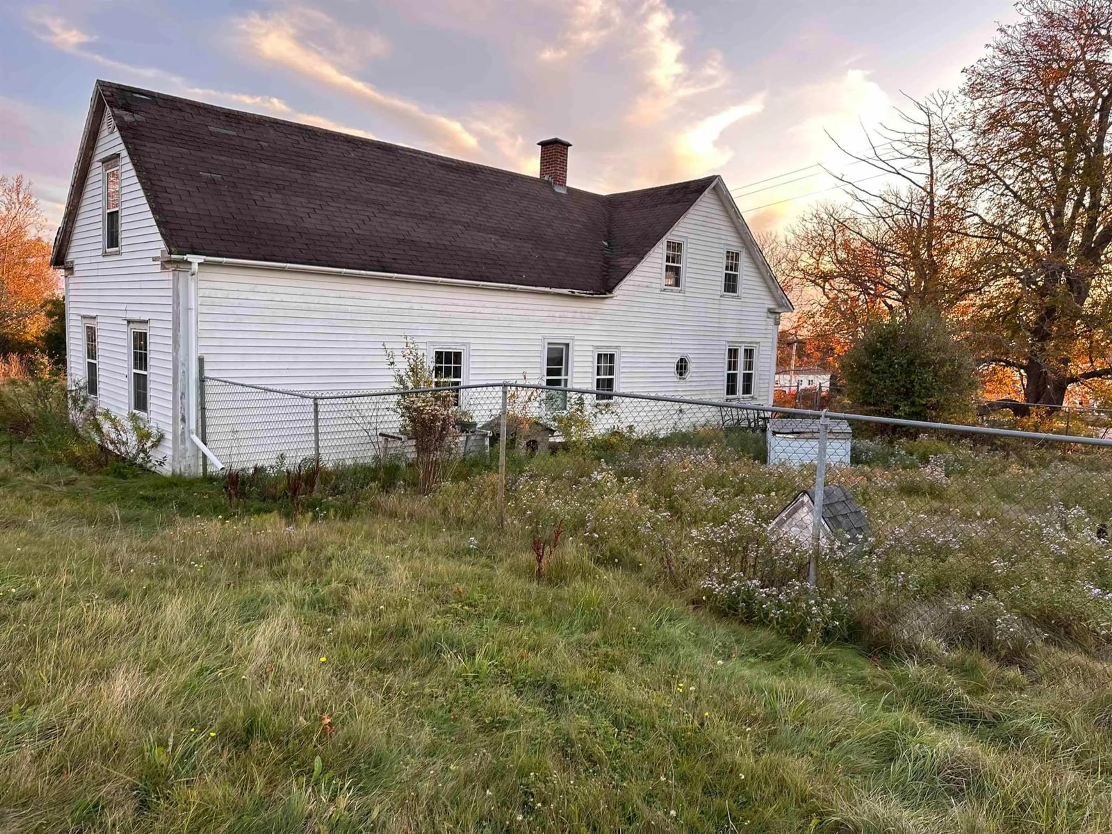 Frontside or backside of a home, the fenced backyard for 190 Main St, Port Hood Nova Scotia B0E 2W0