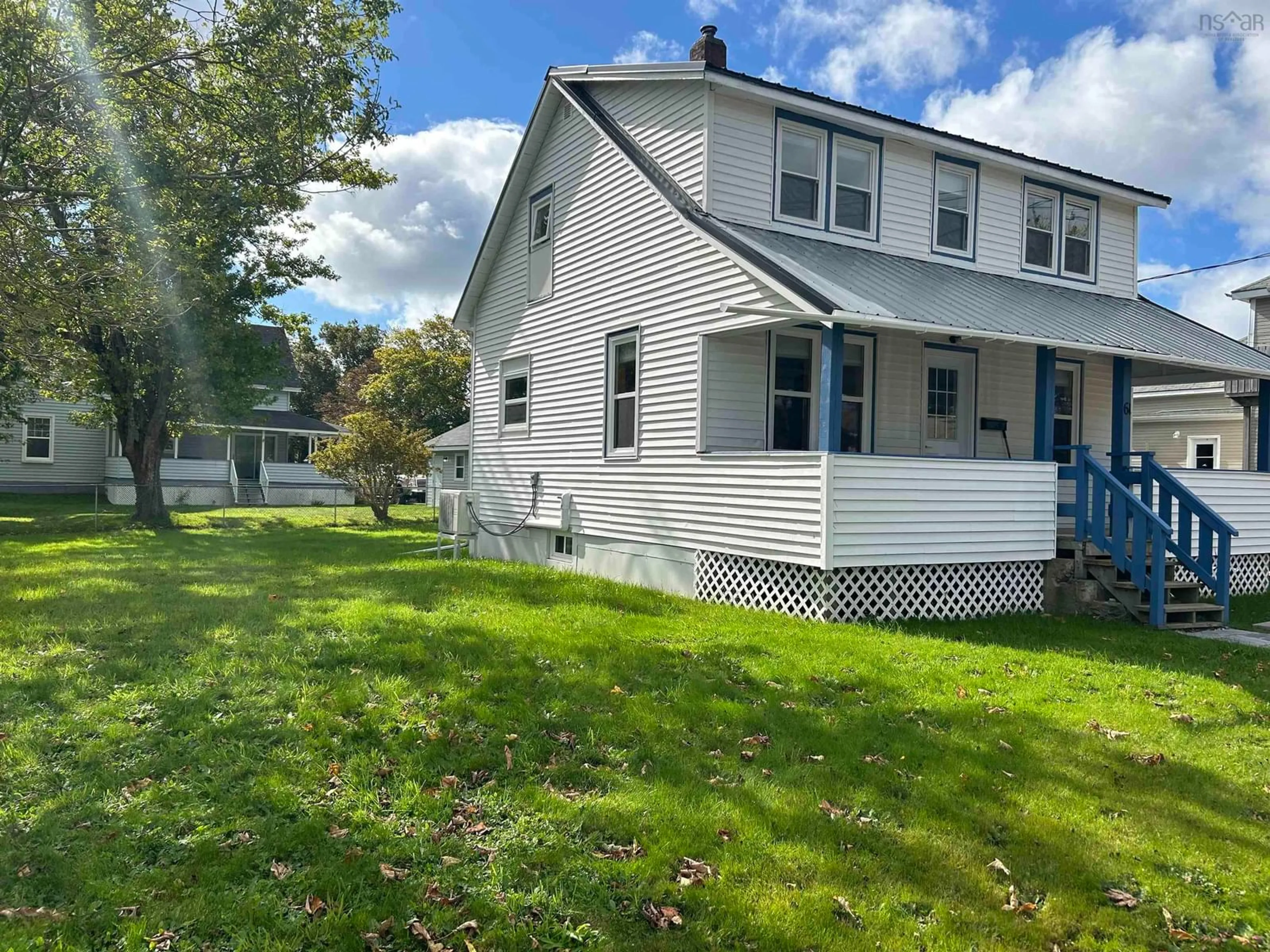 Frontside or backside of a home, the fenced backyard for 61 South East St, Yarmouth Nova Scotia B5A 3P6