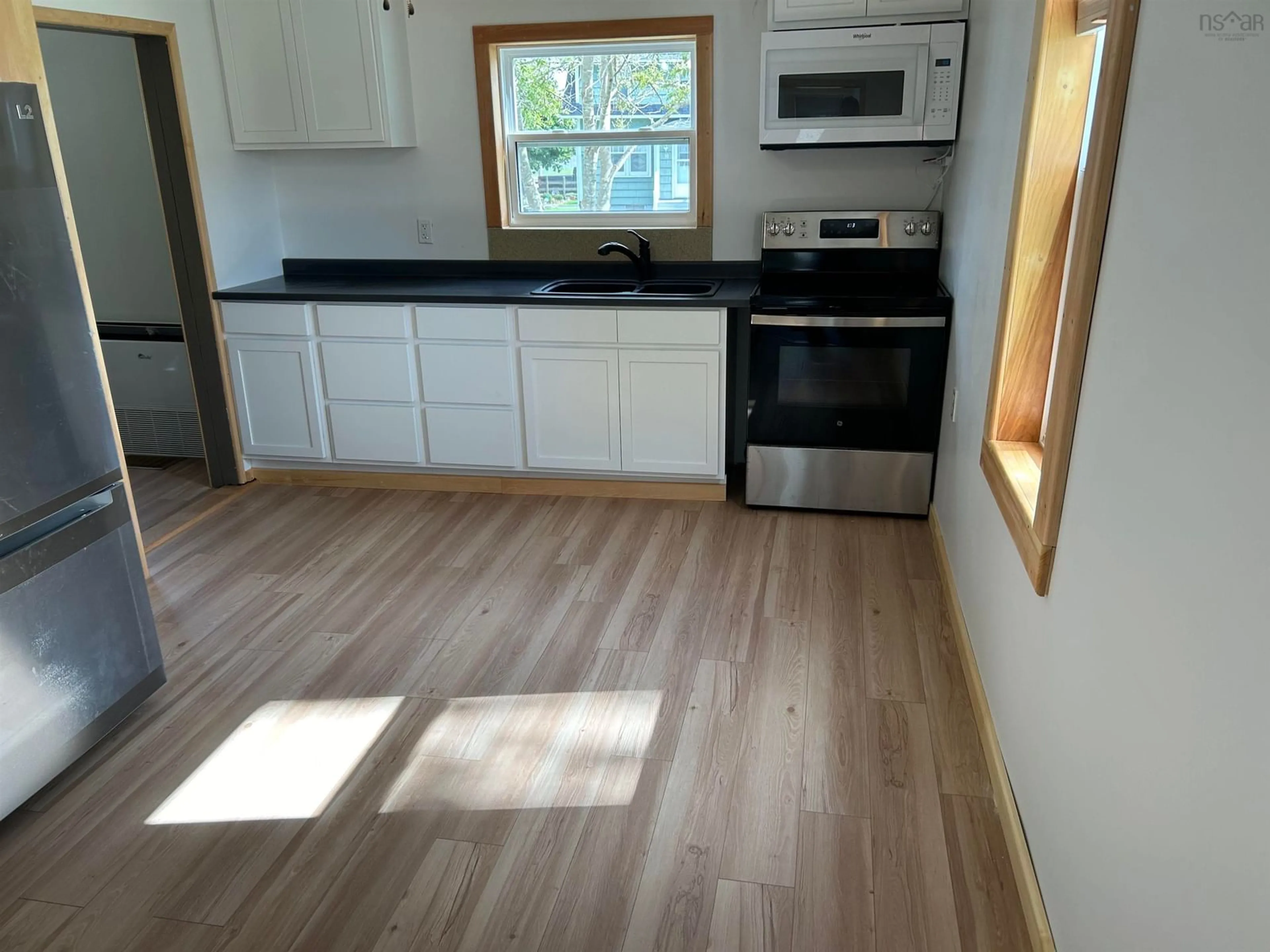 A pic of a room, wood floors for 61 South East St, Yarmouth Nova Scotia B5A 3P6