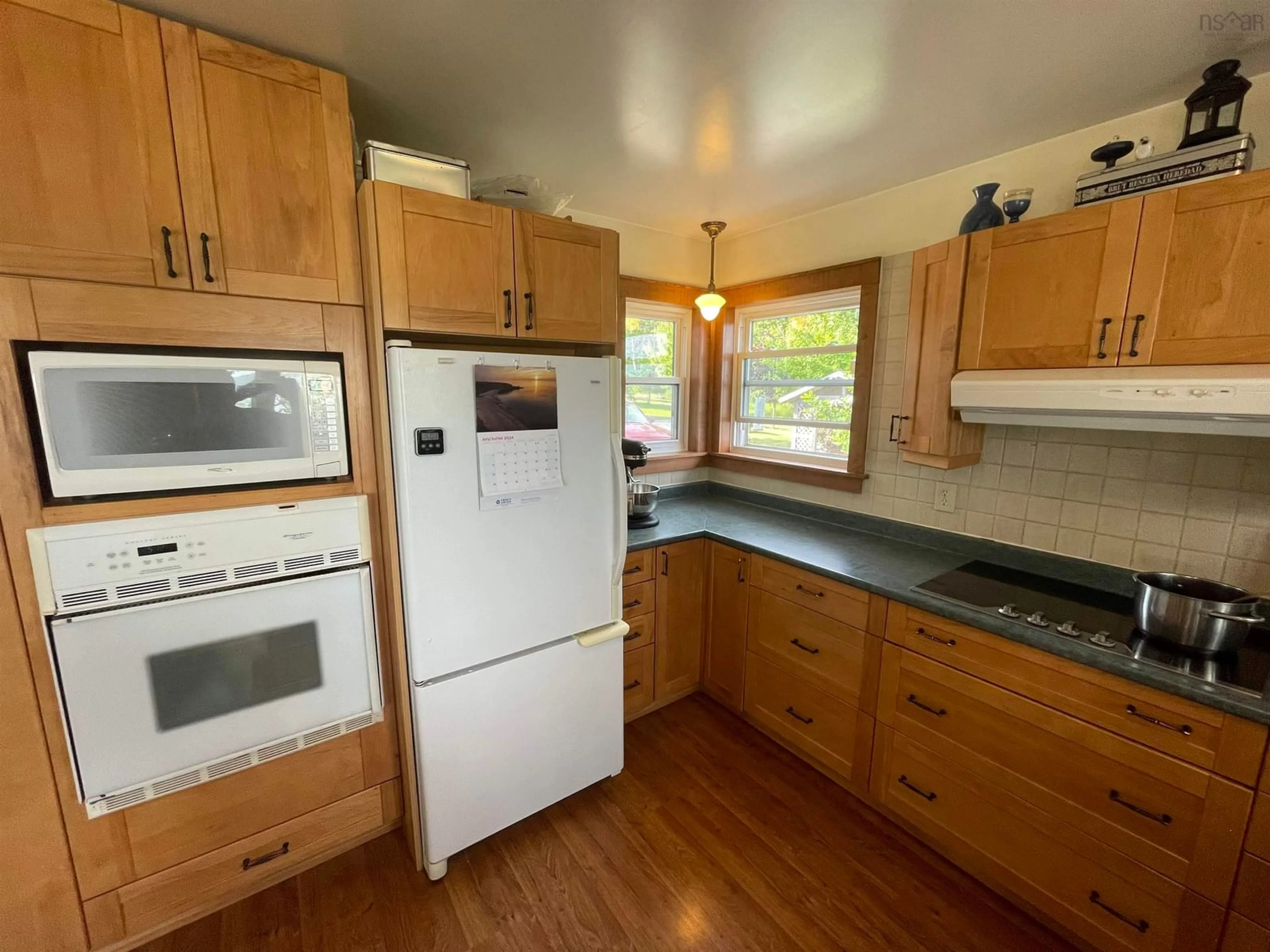 Standard kitchen, wood floors, cottage for 5067 Kempt Head Rd, Southside Boularderie Nova Scotia B1Y 2P3