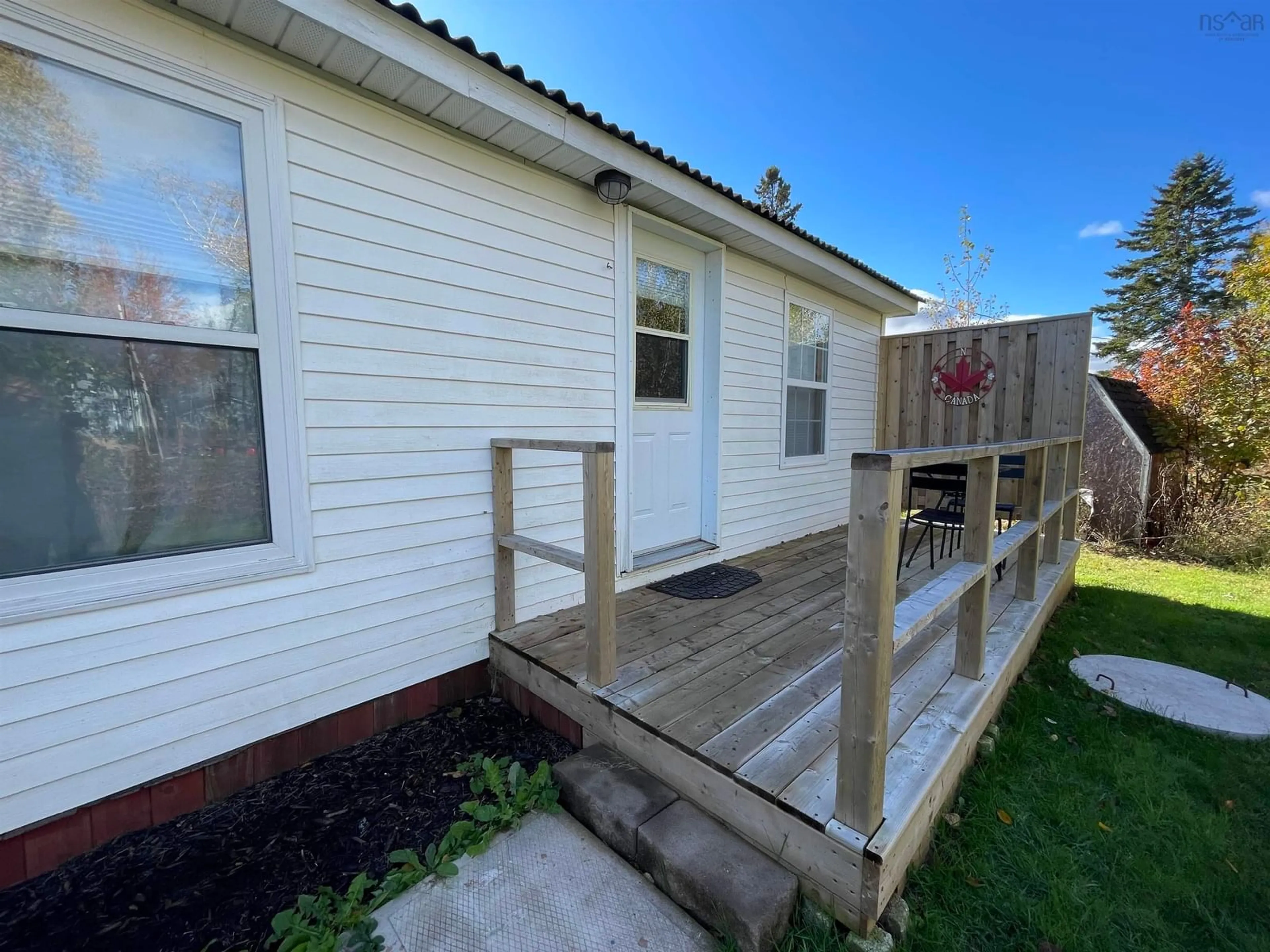 Frontside or backside of a home, the fenced backyard for 40 Jacksons Point Rd, Tidnish Bridge Nova Scotia B4H 3X9