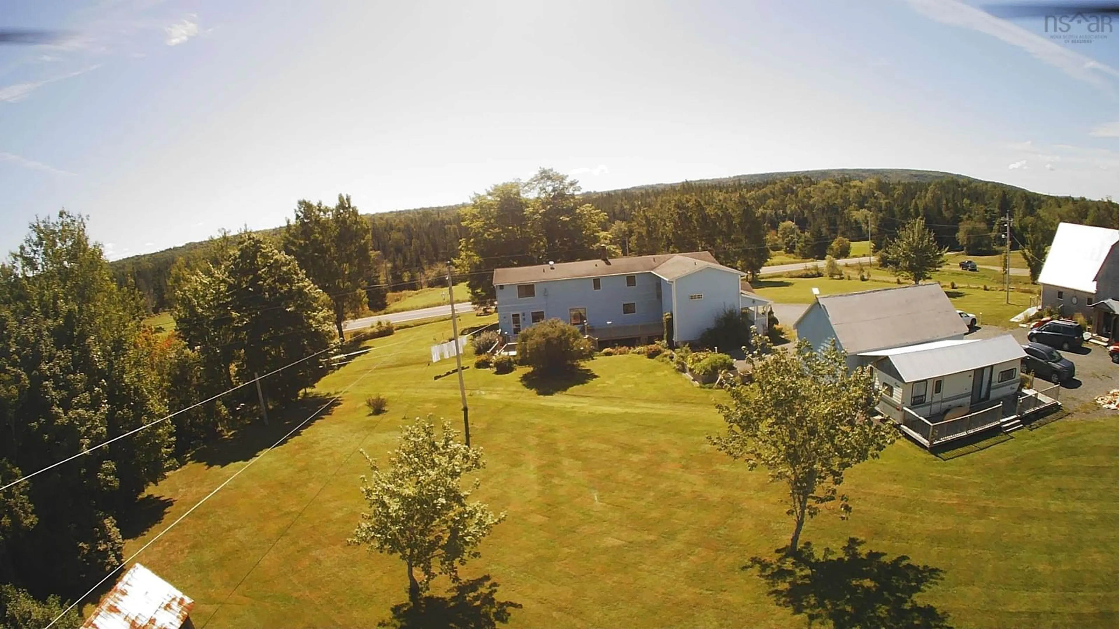 A pic from exterior of the house or condo, the fenced backyard for 1817 Highway 205, Baddeck Bay Nova Scotia B0E 1B0