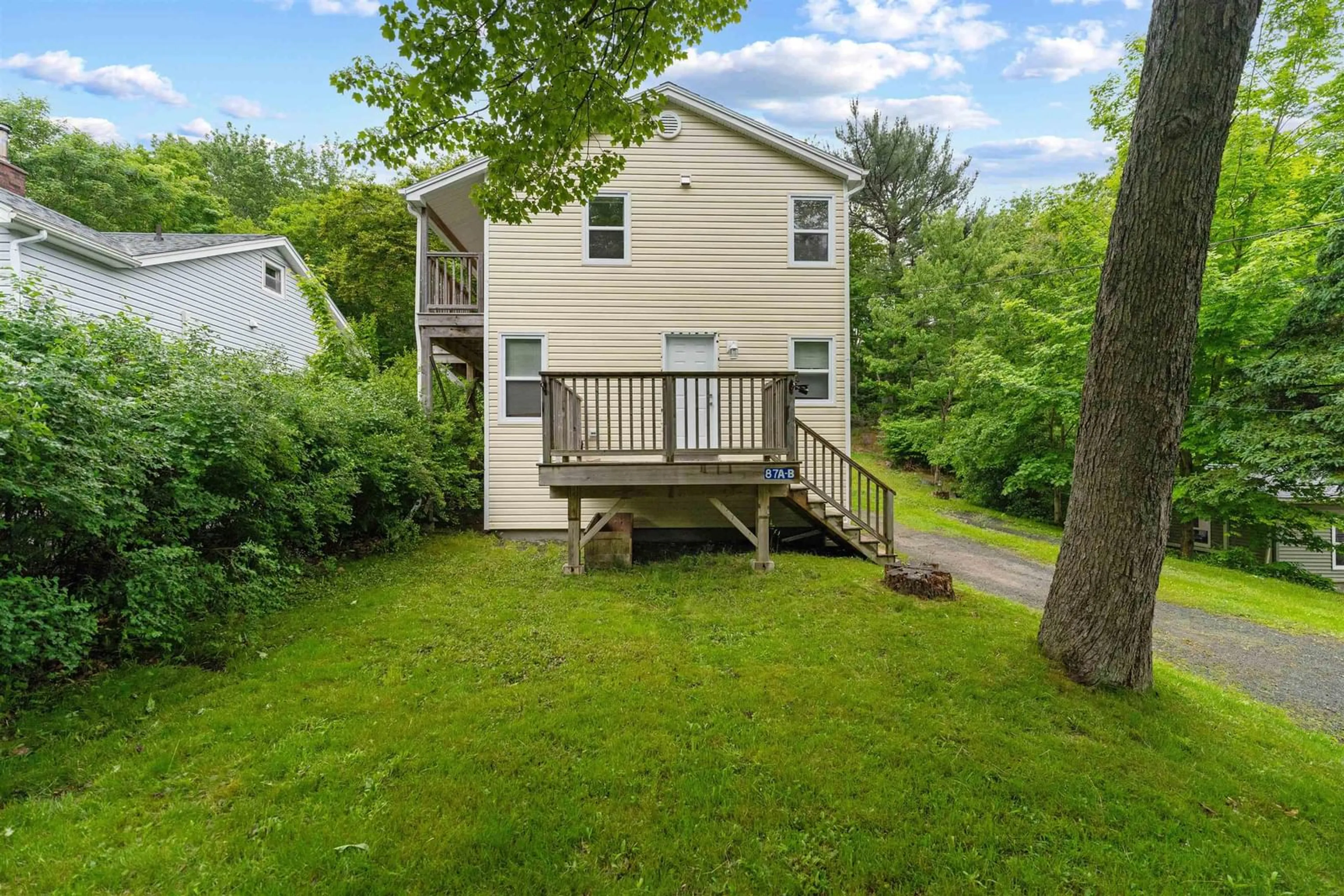 Frontside or backside of a home, the fenced backyard for 87 Meadowbrook Drive, Bedford Nova Scotia B4A 1R2