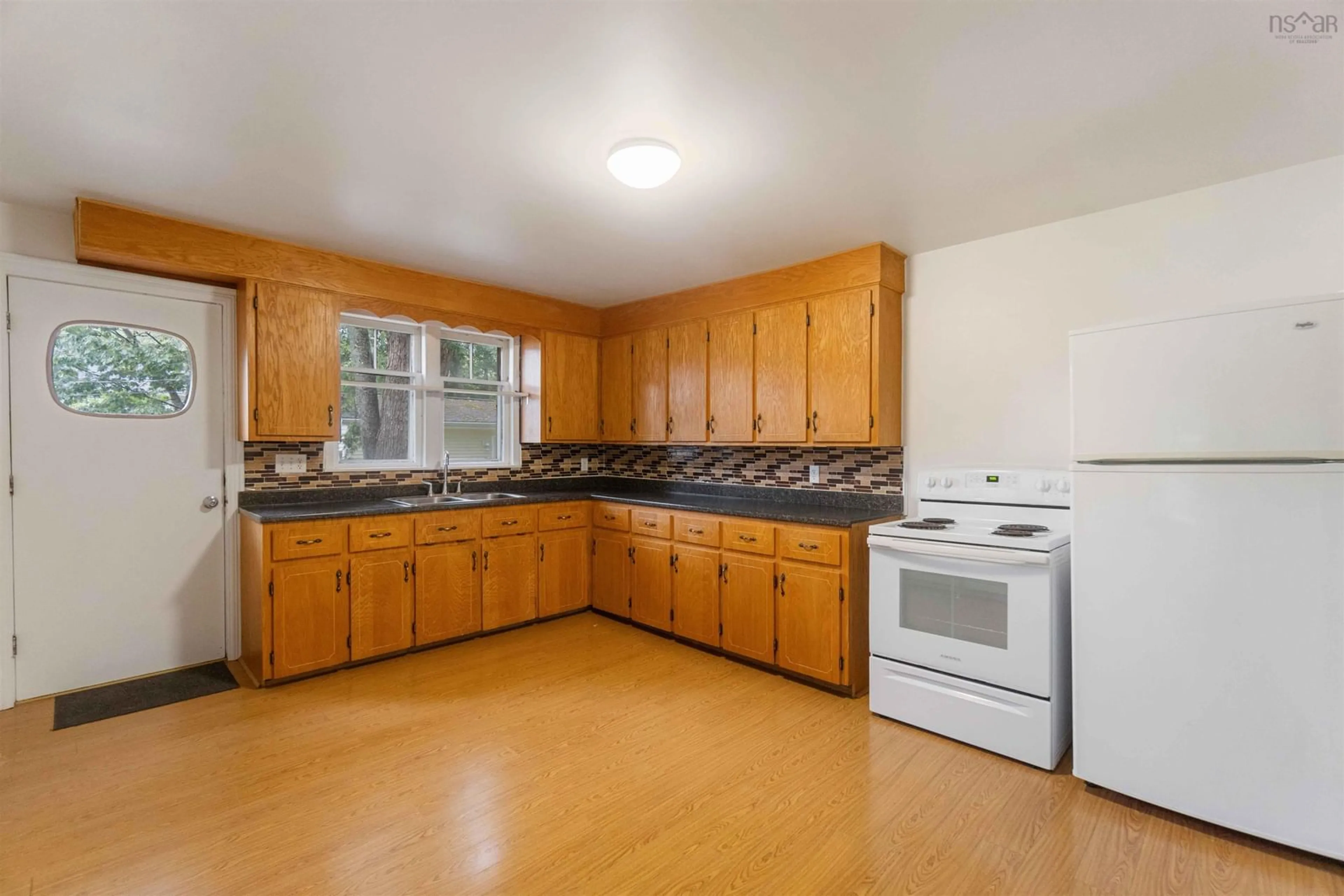 Standard kitchen, wood floors, cottage for 501 Main St, Middleton Nova Scotia B0S 1P0