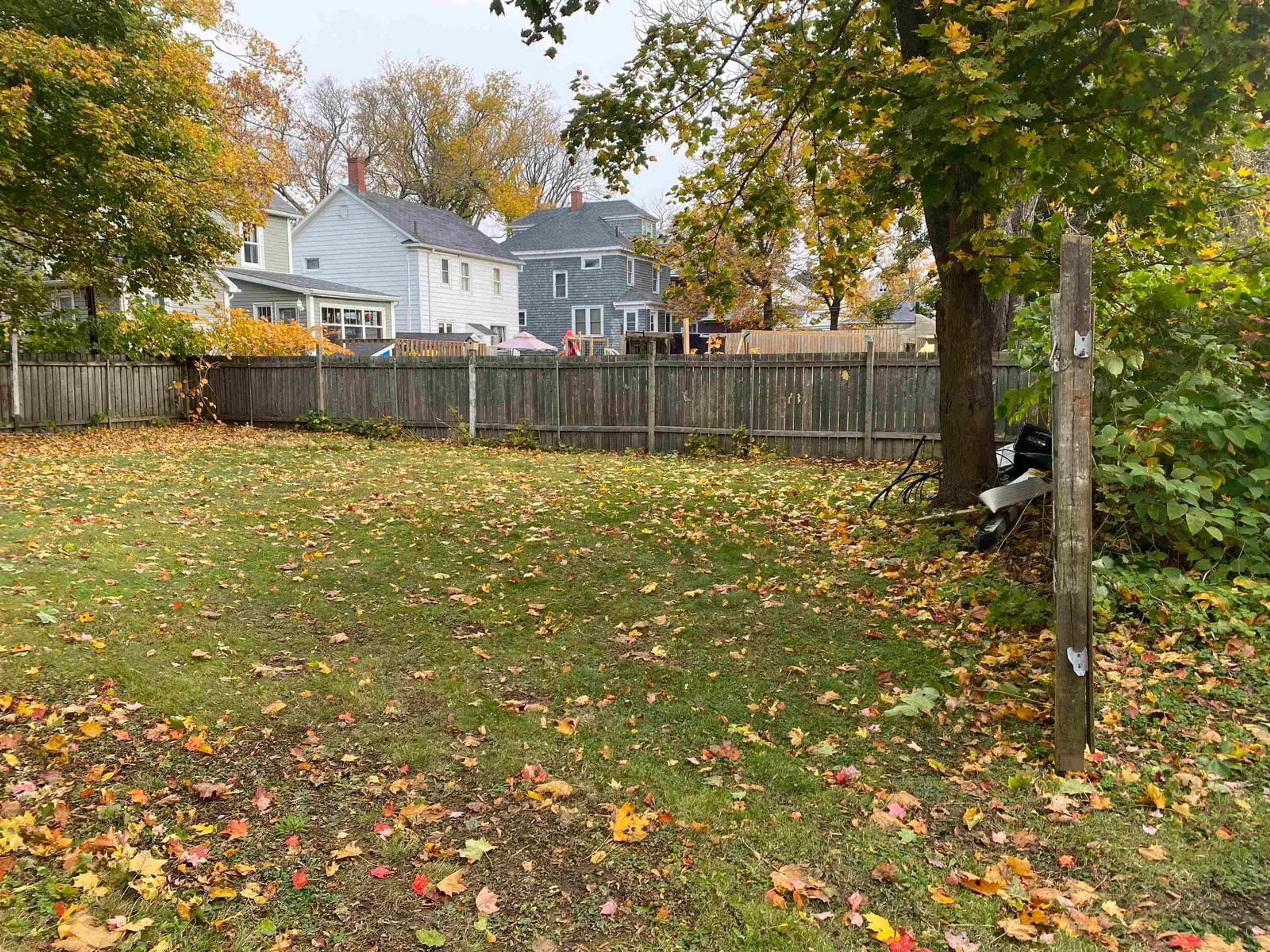 Frontside or backside of a home, the fenced backyard for 11 Hospital Street, Sydney Nova Scotia B1P 2H5