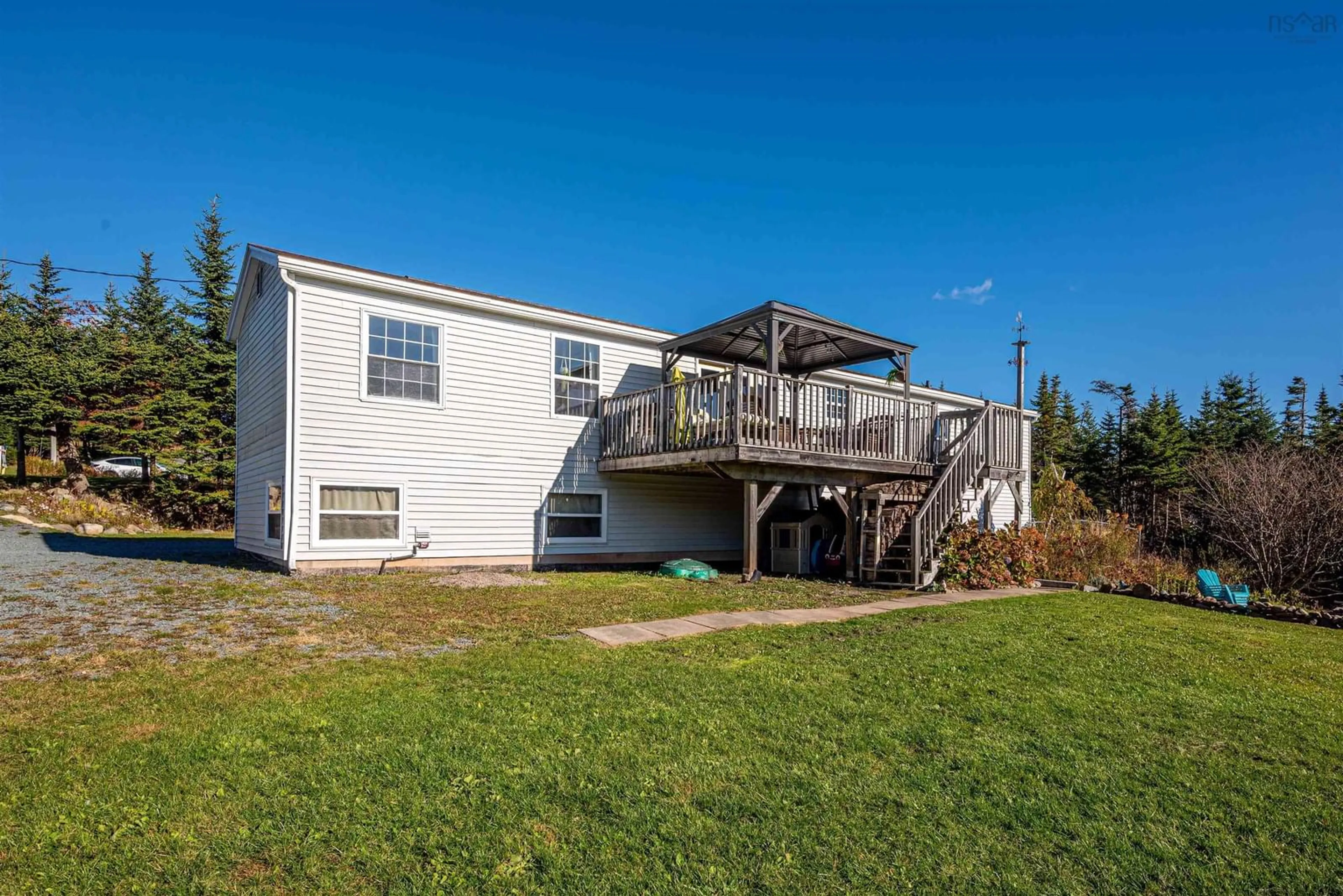 Frontside or backside of a home, the fenced backyard for 3750 Lawrencetown Rd, Lawrencetown Nova Scotia B2Z 1P9