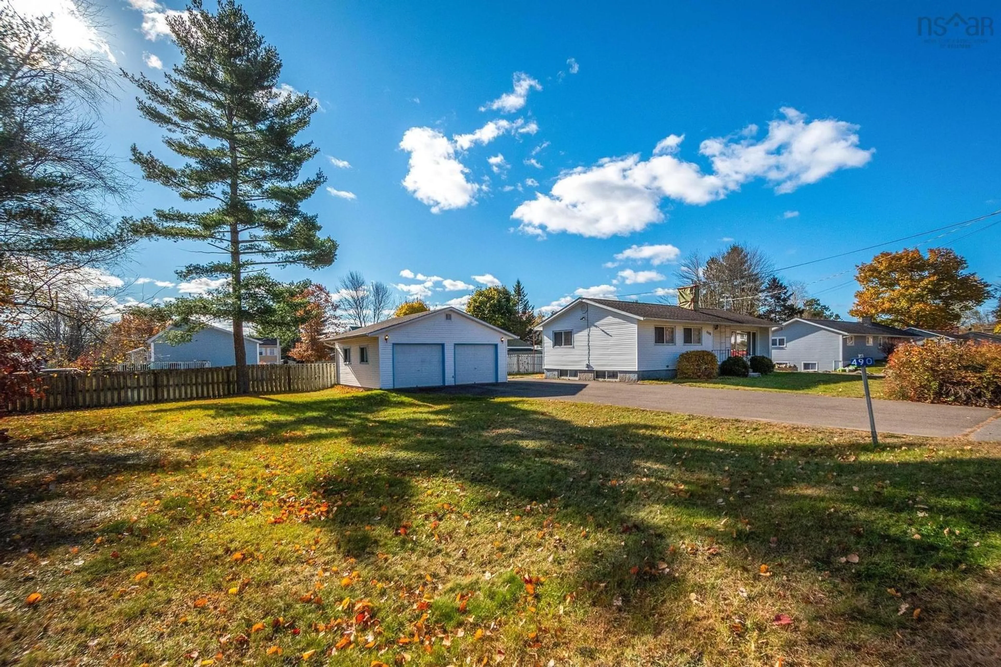 A pic from exterior of the house or condo, the fenced backyard for 490 Pine Ridge Ave, Kingston Nova Scotia B0P 1R0