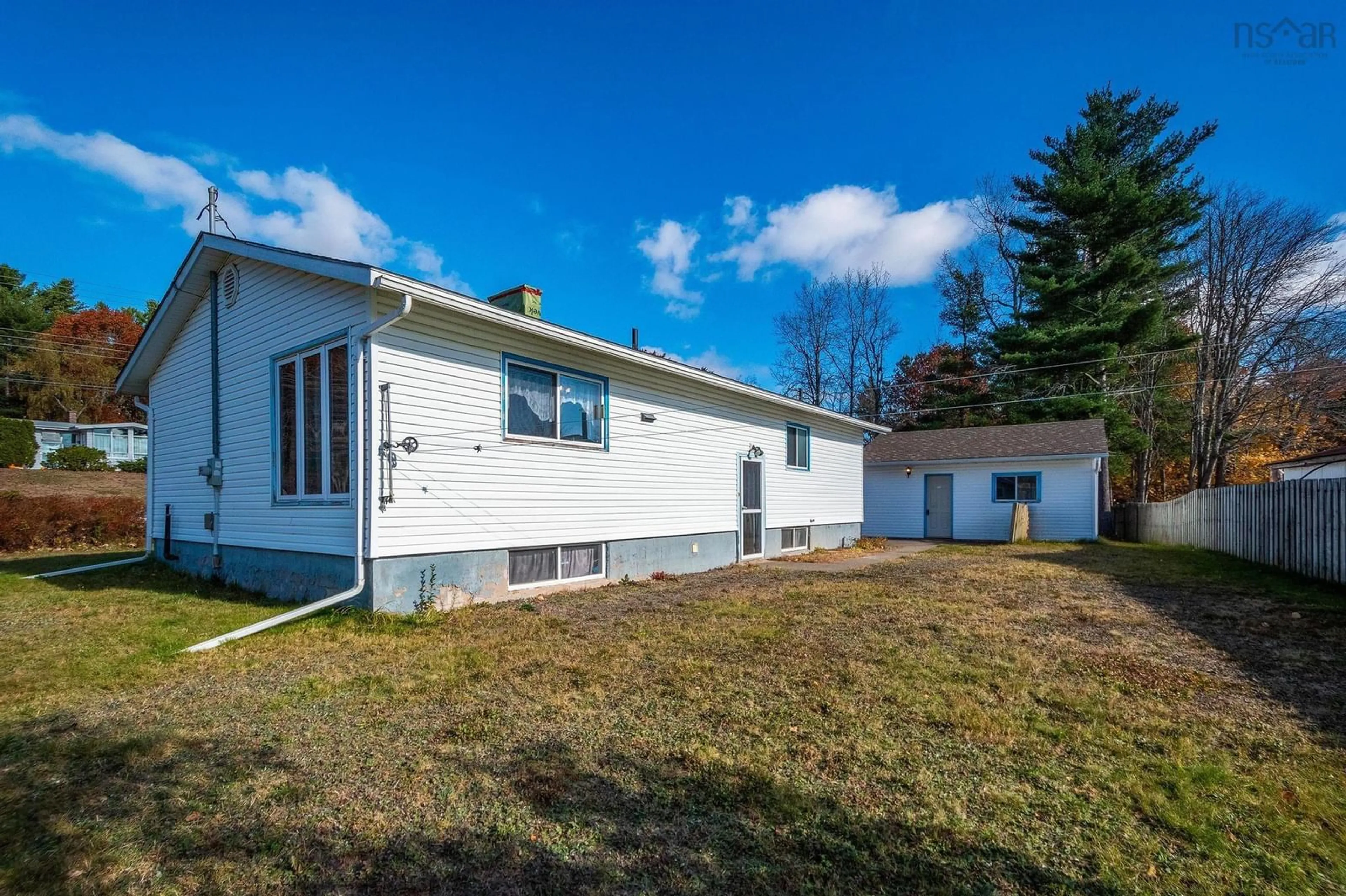 Frontside or backside of a home, the fenced backyard for 490 Pine Ridge Ave, Kingston Nova Scotia B0P 1R0