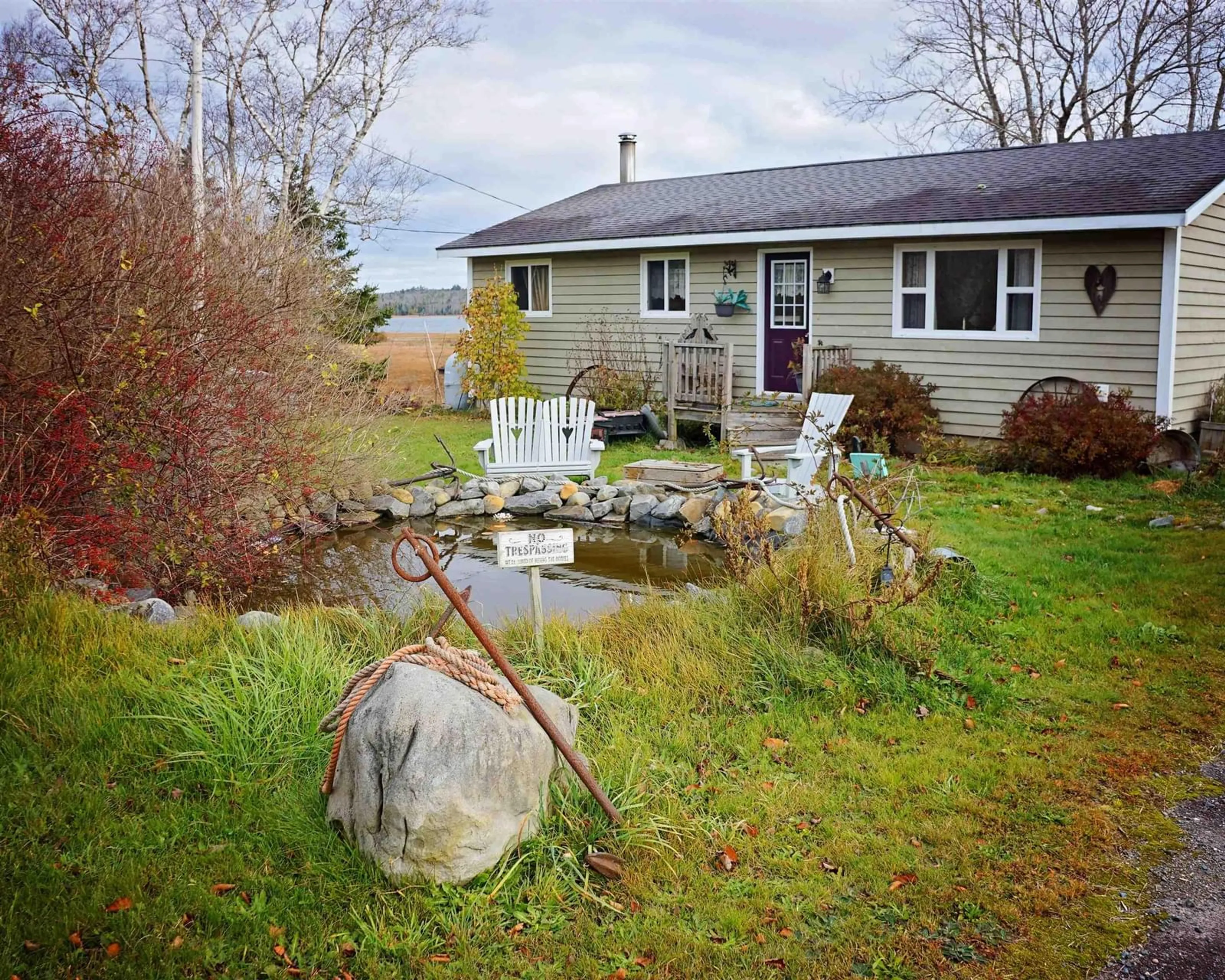 Frontside or backside of a home, the fenced backyard for 733 West Middle Sable Rd, West Middle Sable Nova Scotia B0T 1V0