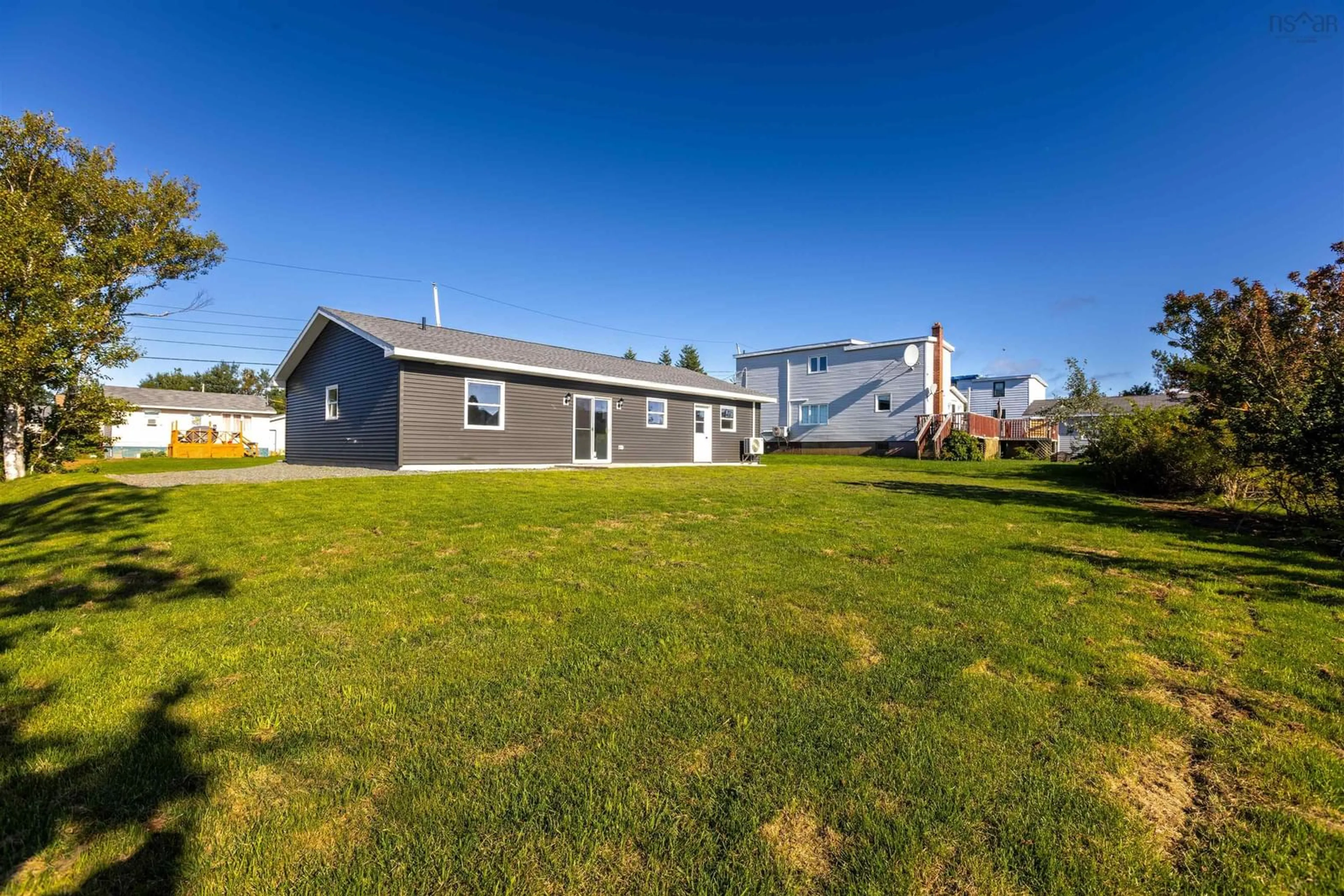 Frontside or backside of a home, the fenced backyard for 17 Maxie St, Glace Bay Nova Scotia B1A 2E3