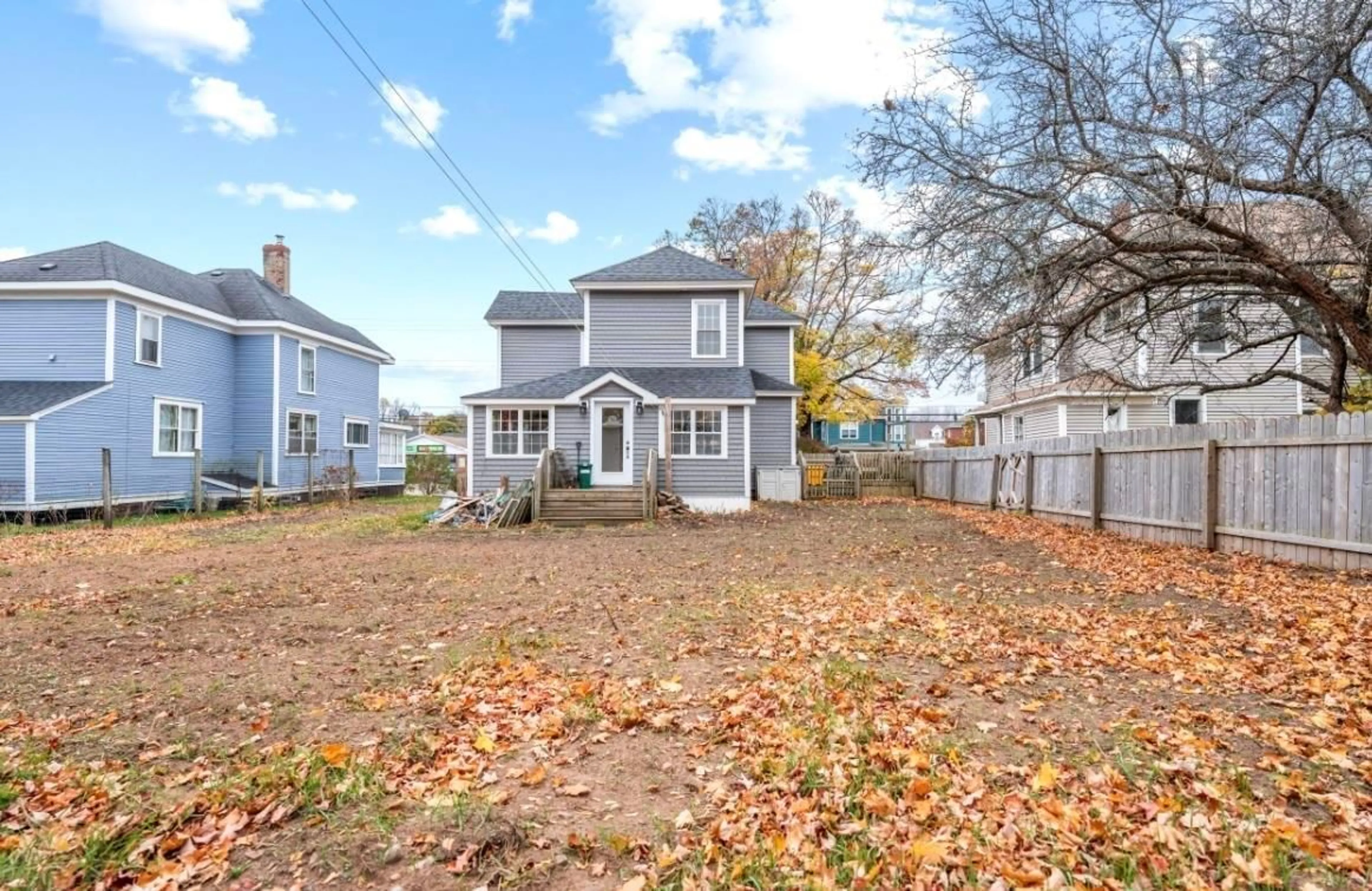 Frontside or backside of a home, the fenced backyard for 124 Church St, Amherst Nova Scotia B4H 3B8