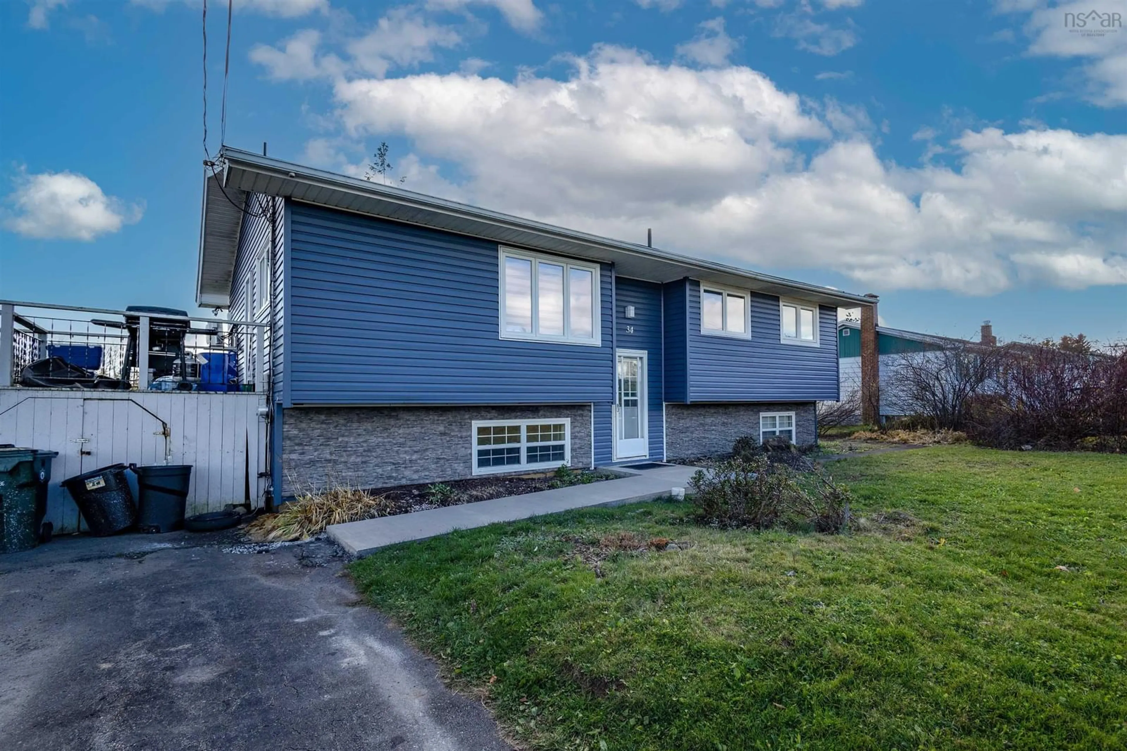 Frontside or backside of a home, the fenced backyard for 34 Patnic Ave, Sydney Nova Scotia B1P 3G5