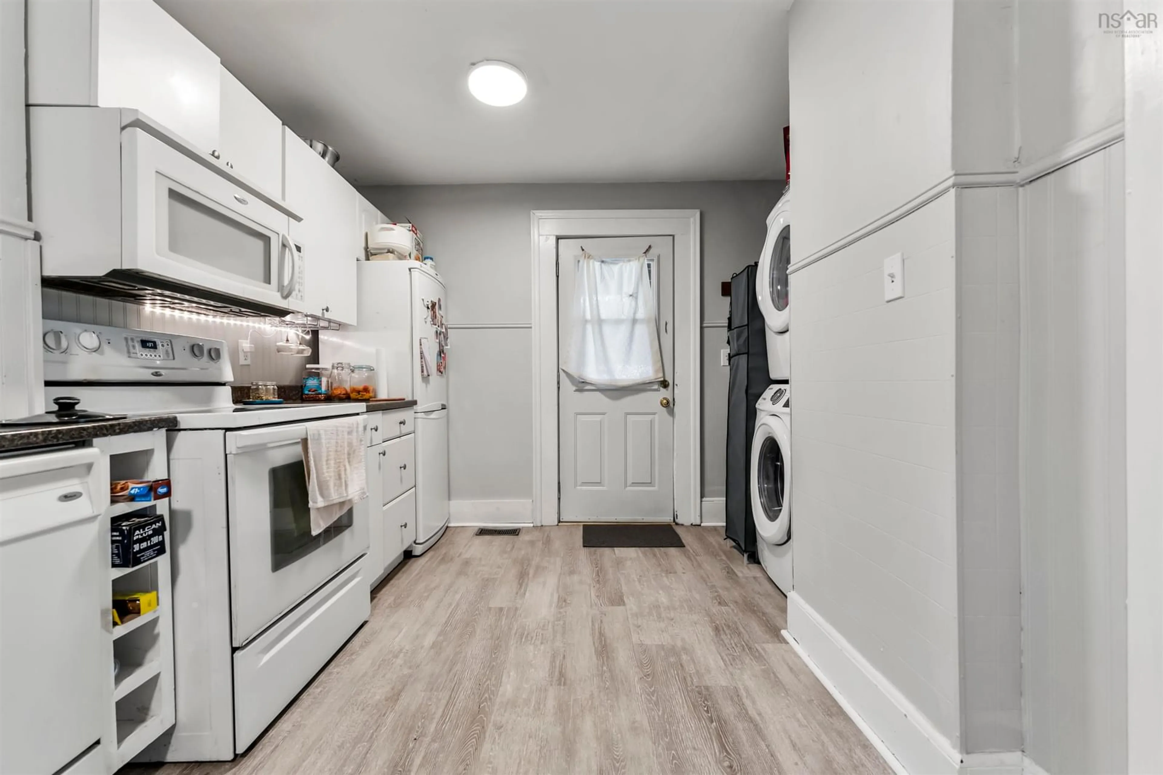 Kitchen with laundary machines, wood floors for 160 Windmill Rd, Dartmouth Nova Scotia B3A 1E6