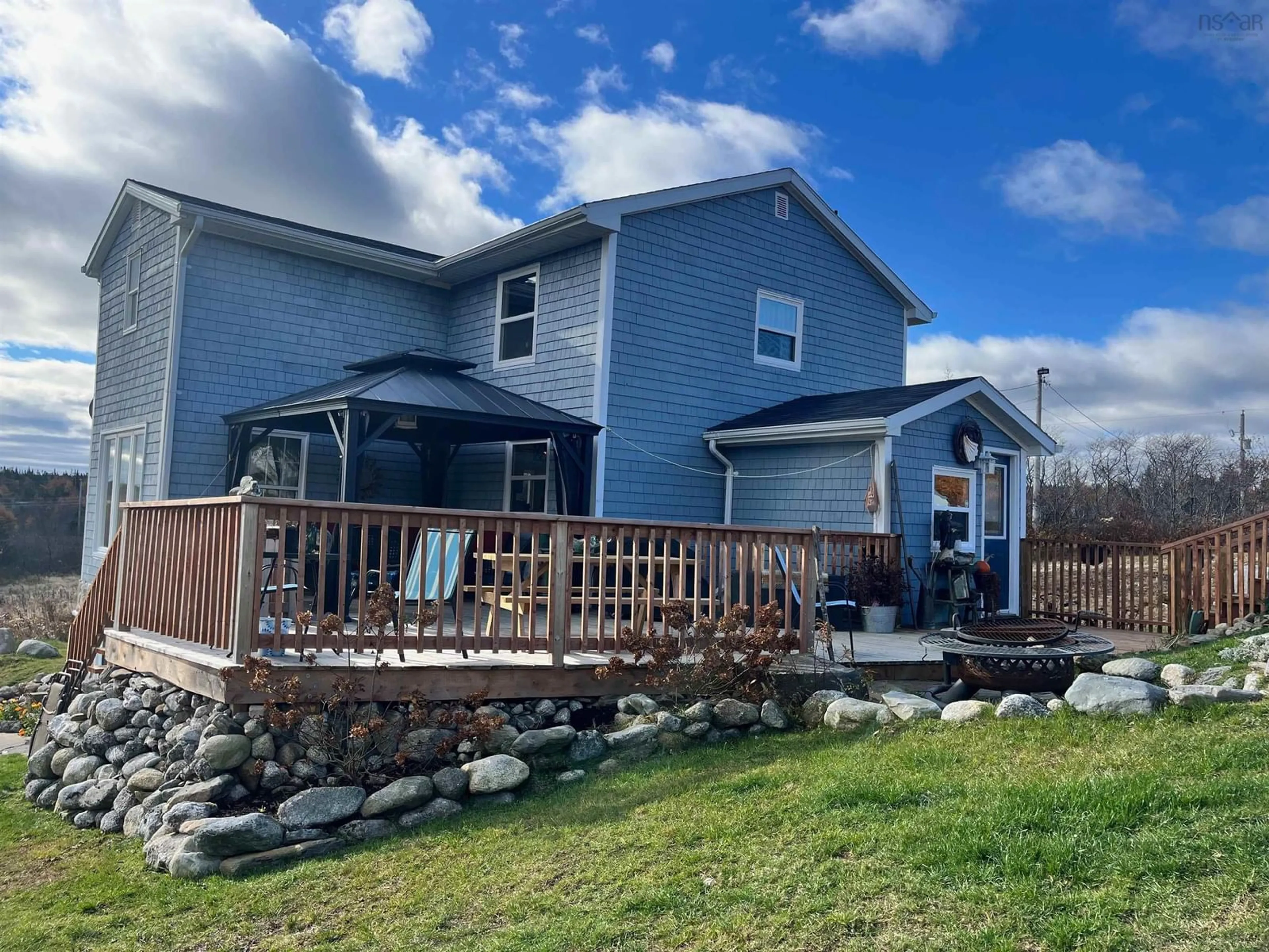 Frontside or backside of a home, the fenced backyard for 130 Larry's River Road, Larry's River Nova Scotia B0H 1T0