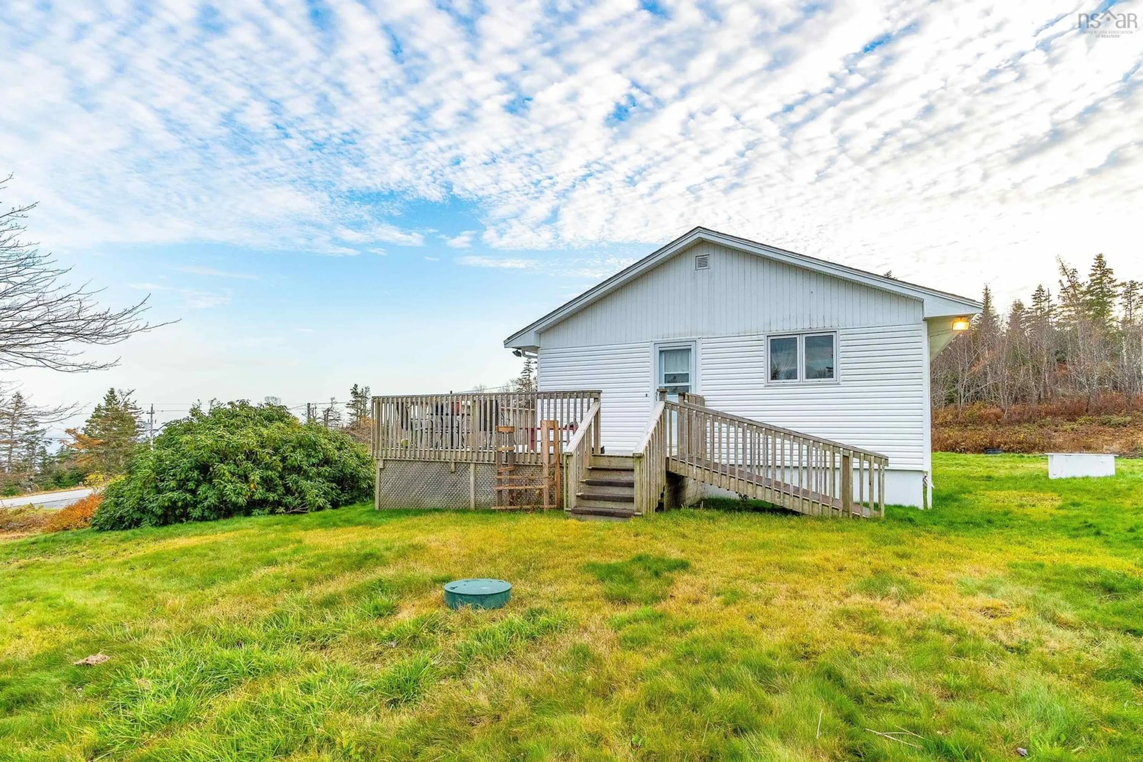 Frontside or backside of a home, the fenced backyard for 28019 7 Hwy, Moosehead Nova Scotia B0J 2K0