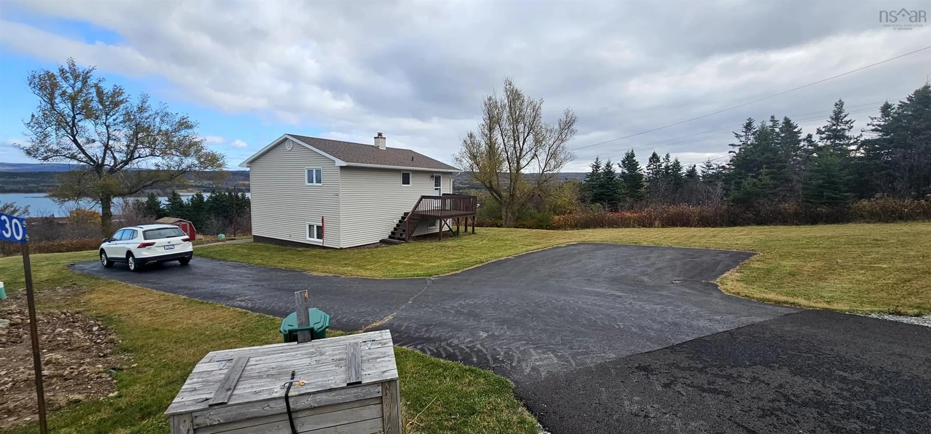 Frontside or backside of a home, the fenced backyard for 1630 Havre Boucher Rd, Havre Boucher Nova Scotia B0H 1P0