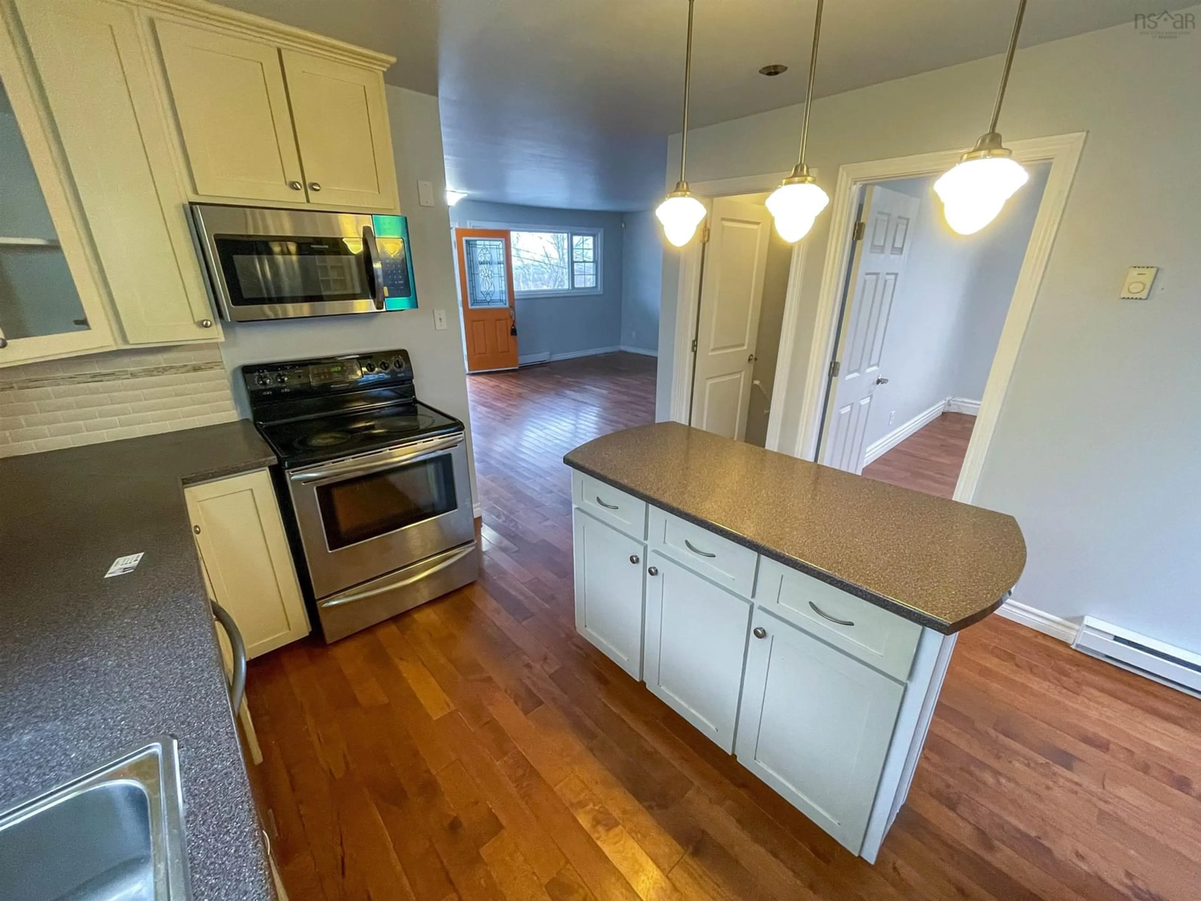 Open concept kitchen for 58 Common St, Sydney Nova Scotia B1P 6M5