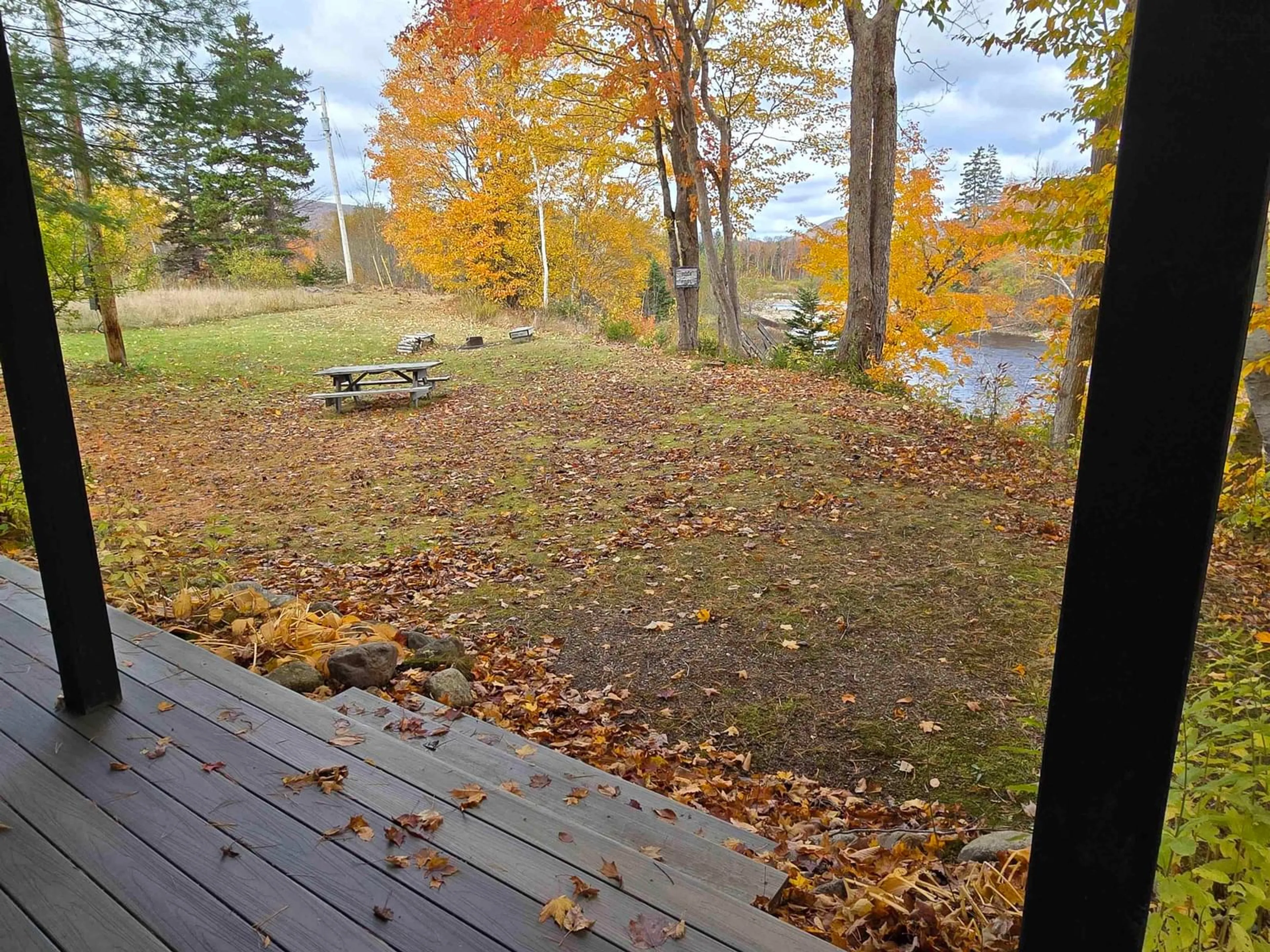 Patio, the fenced backyard for 124 Crowdis Crossing Rd, Margaree Valley Nova Scotia B0E 2C0