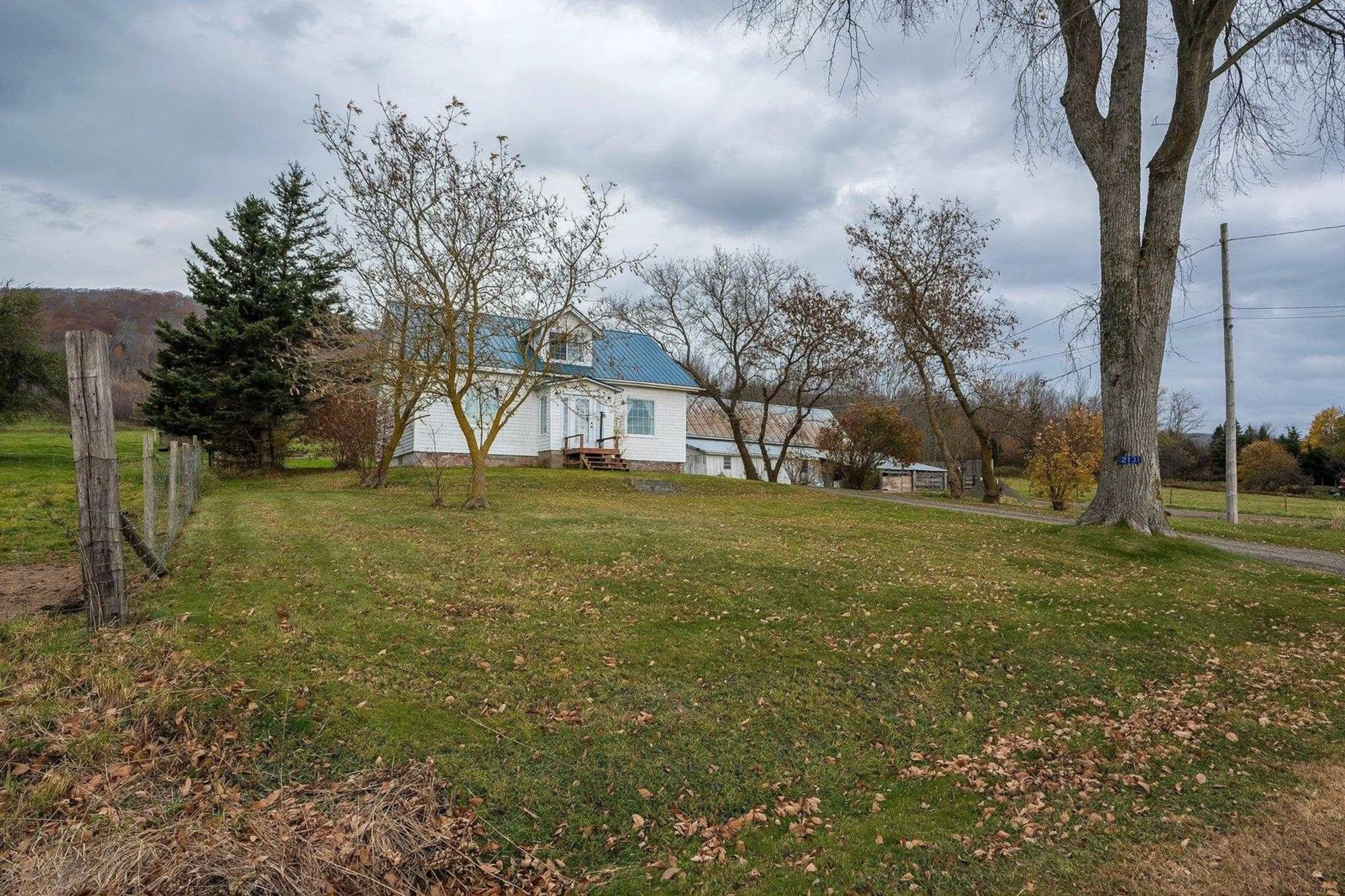 Frontside or backside of a home, the fenced backyard for 2131 Clarence Rd, Clarence Nova Scotia B0S 1C0