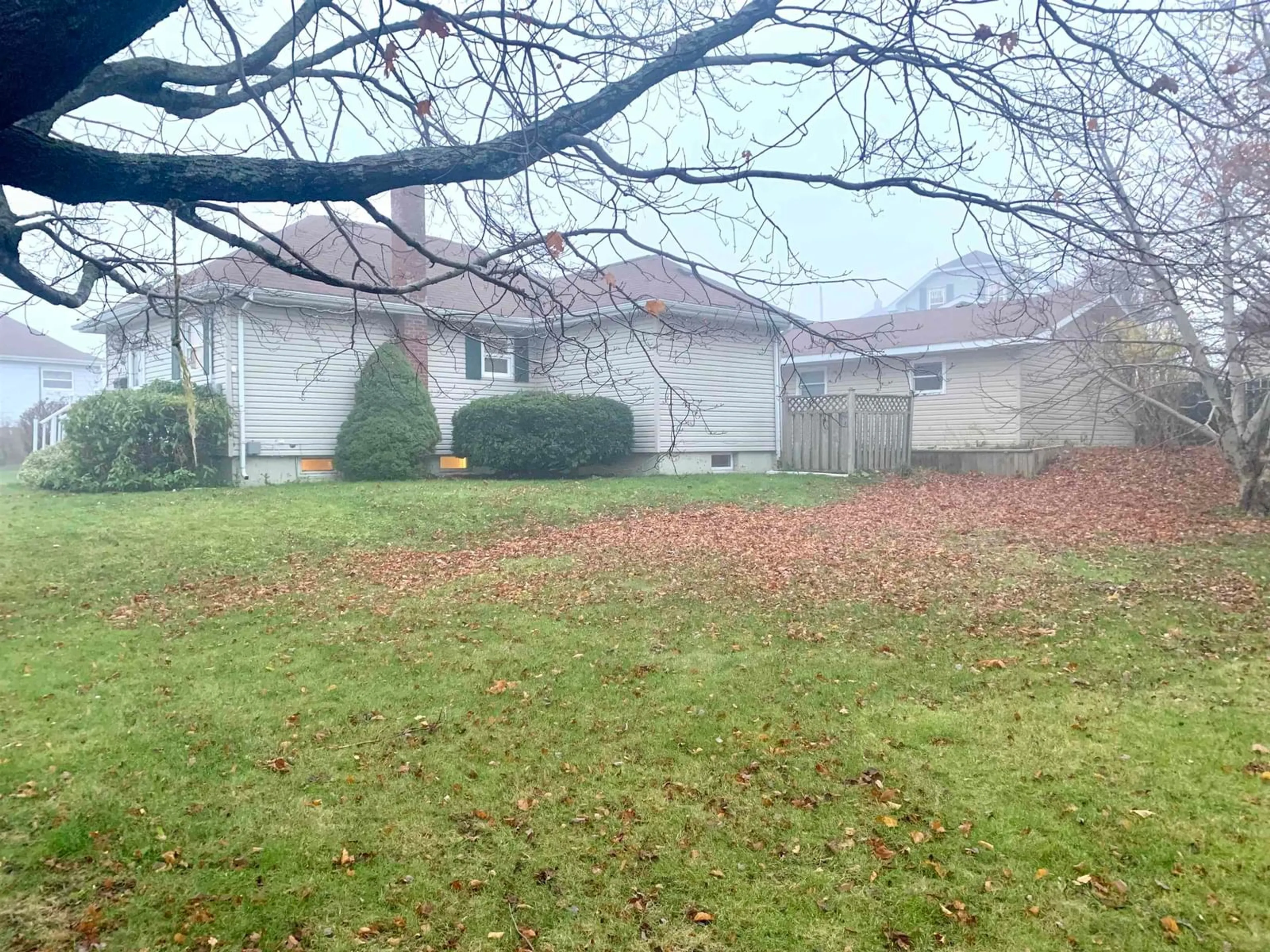 Frontside or backside of a home, the fenced backyard for 1012 May St, Scotchtown Nova Scotia B1H 1E4