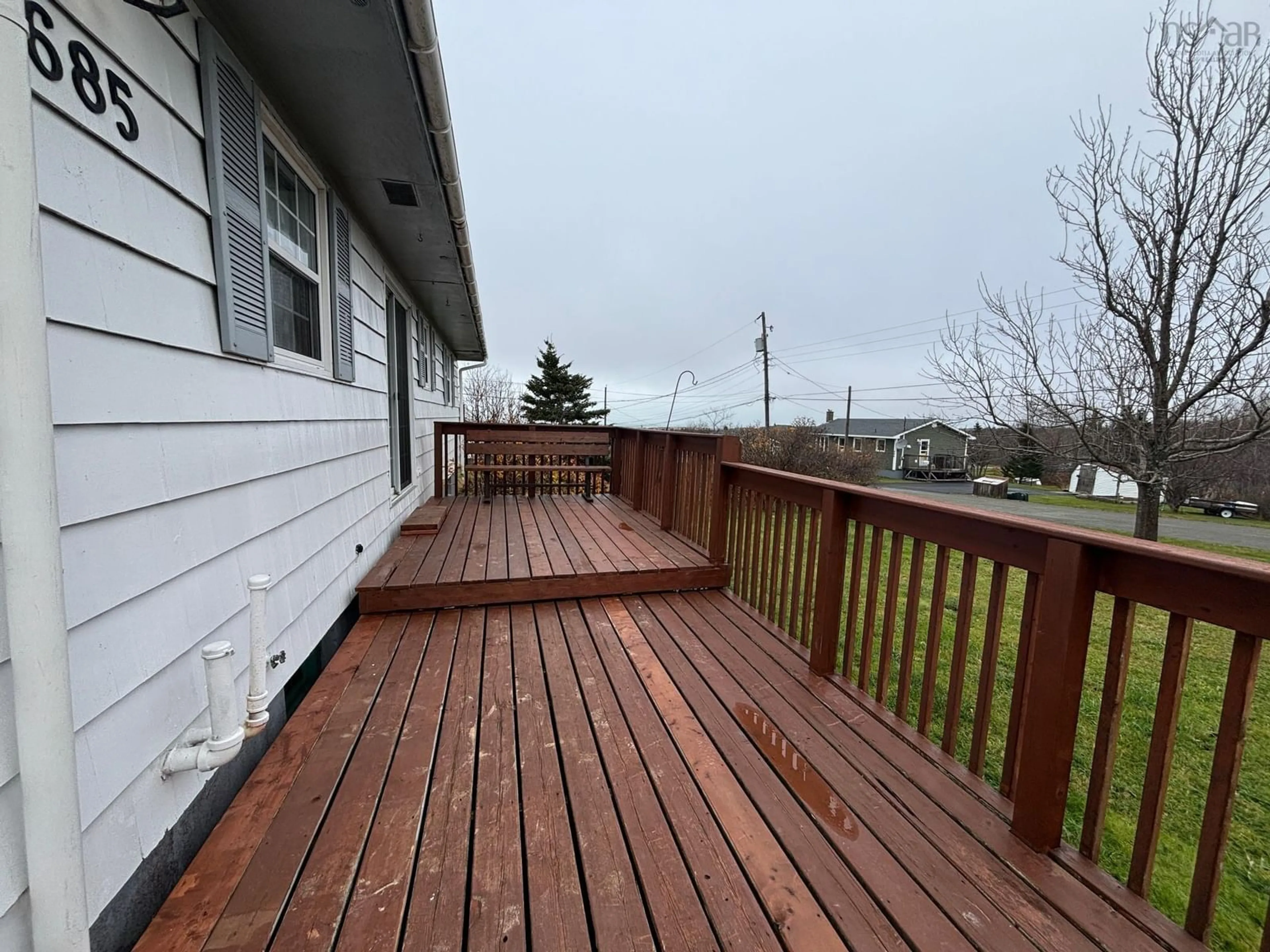 Frontside or backside of a home, the fenced backyard for 685 Hulmes Lane, New Waterford Nova Scotia B1H 4V1