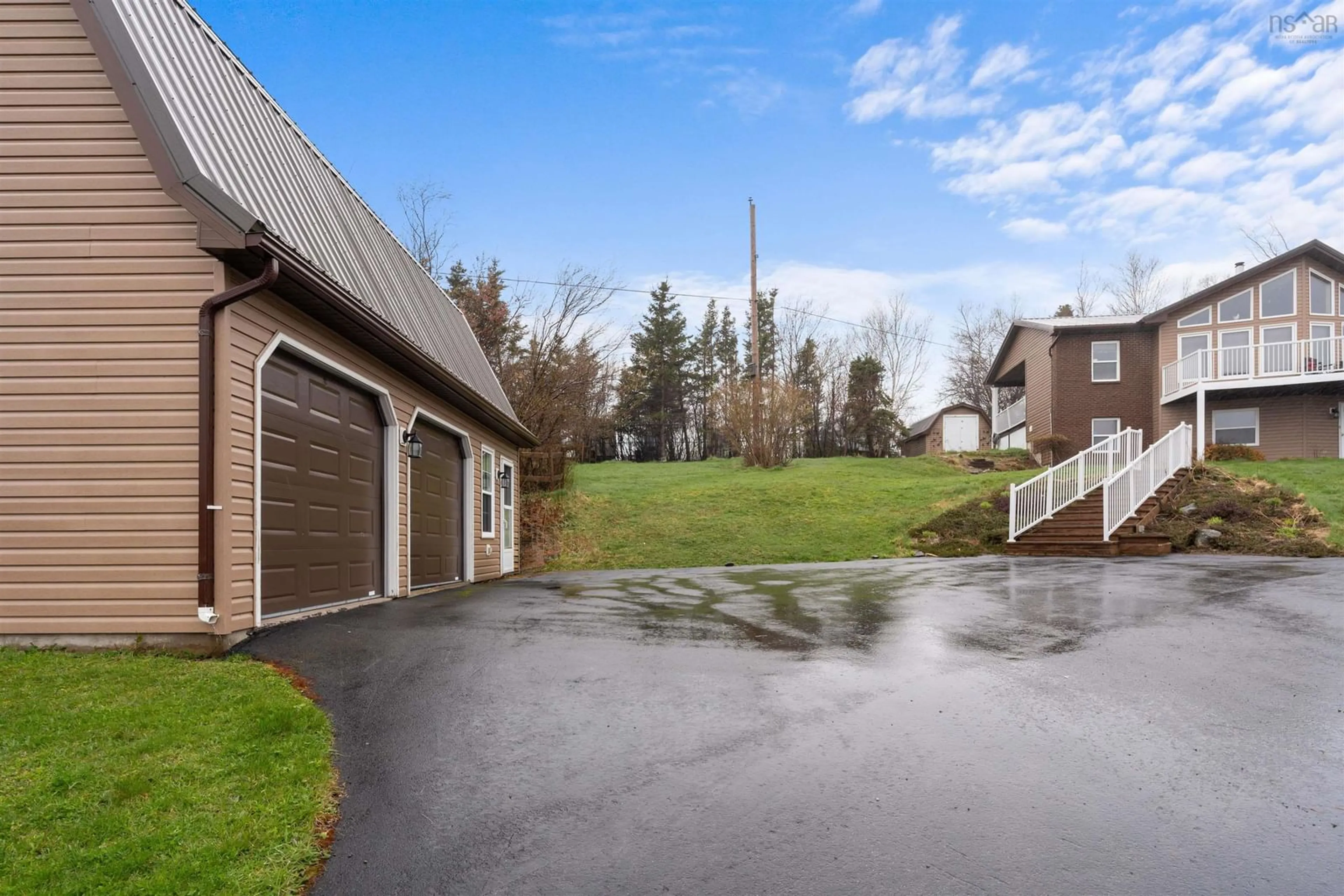 Frontside or backside of a home, the fenced backyard for 39 Blue Heron Dr, Black Point Nova Scotia B0K 1X0