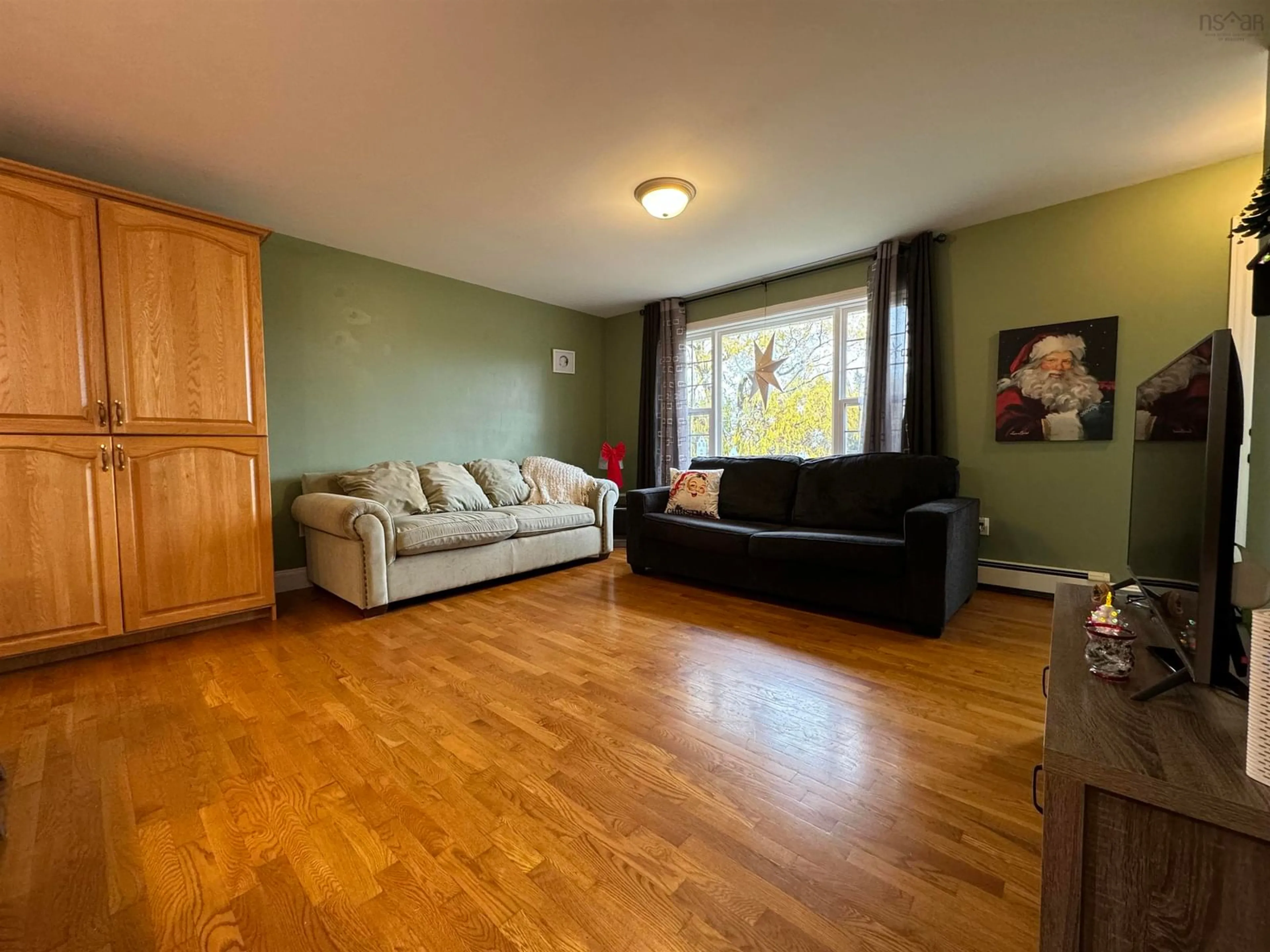 Living room, wood floors for 77 De Raymond St, St. Peter's Nova Scotia B0E 3B0