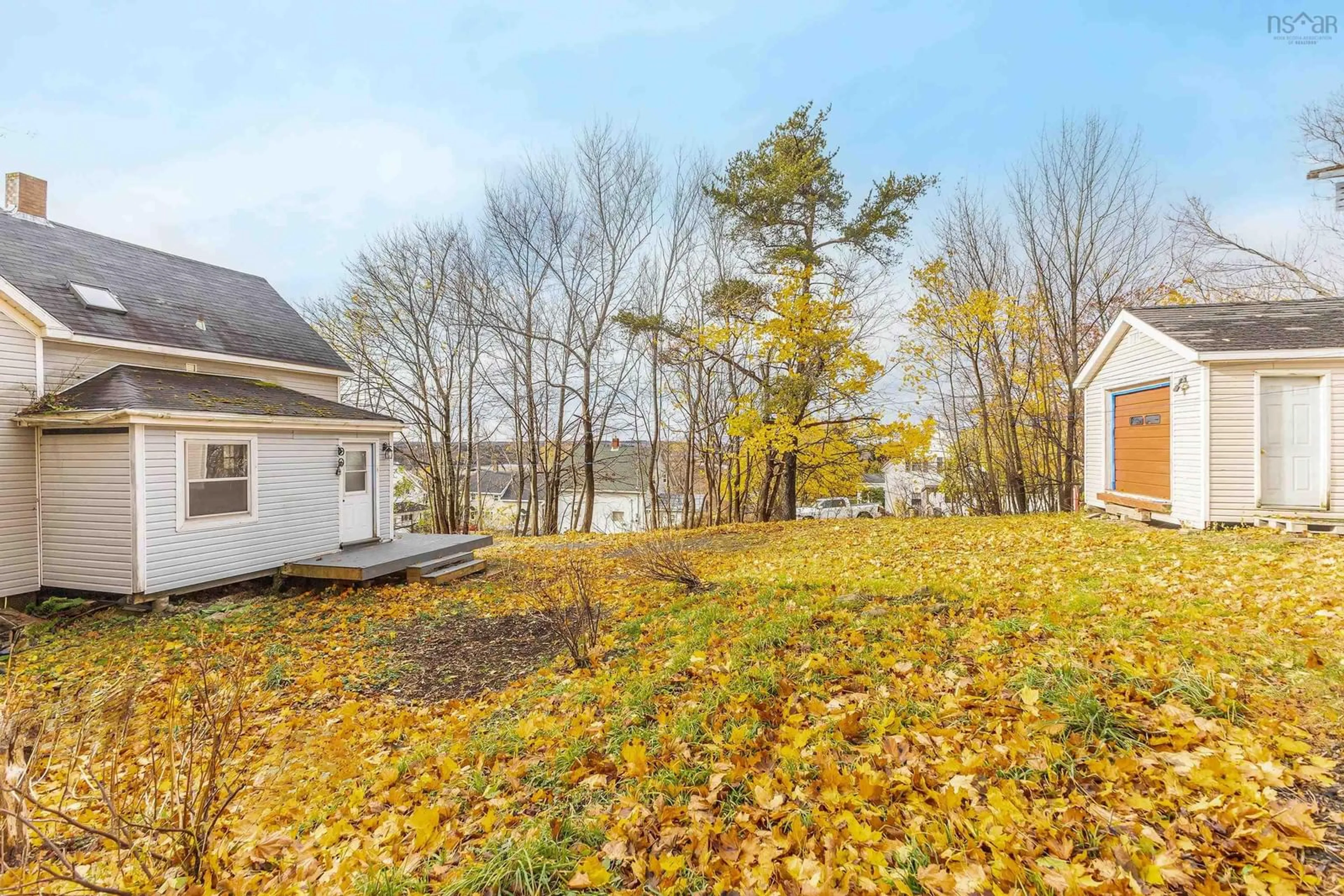 A pic from exterior of the house or condo, the fenced backyard for 17 Mechanic St, Trenton Nova Scotia B0K 1X0