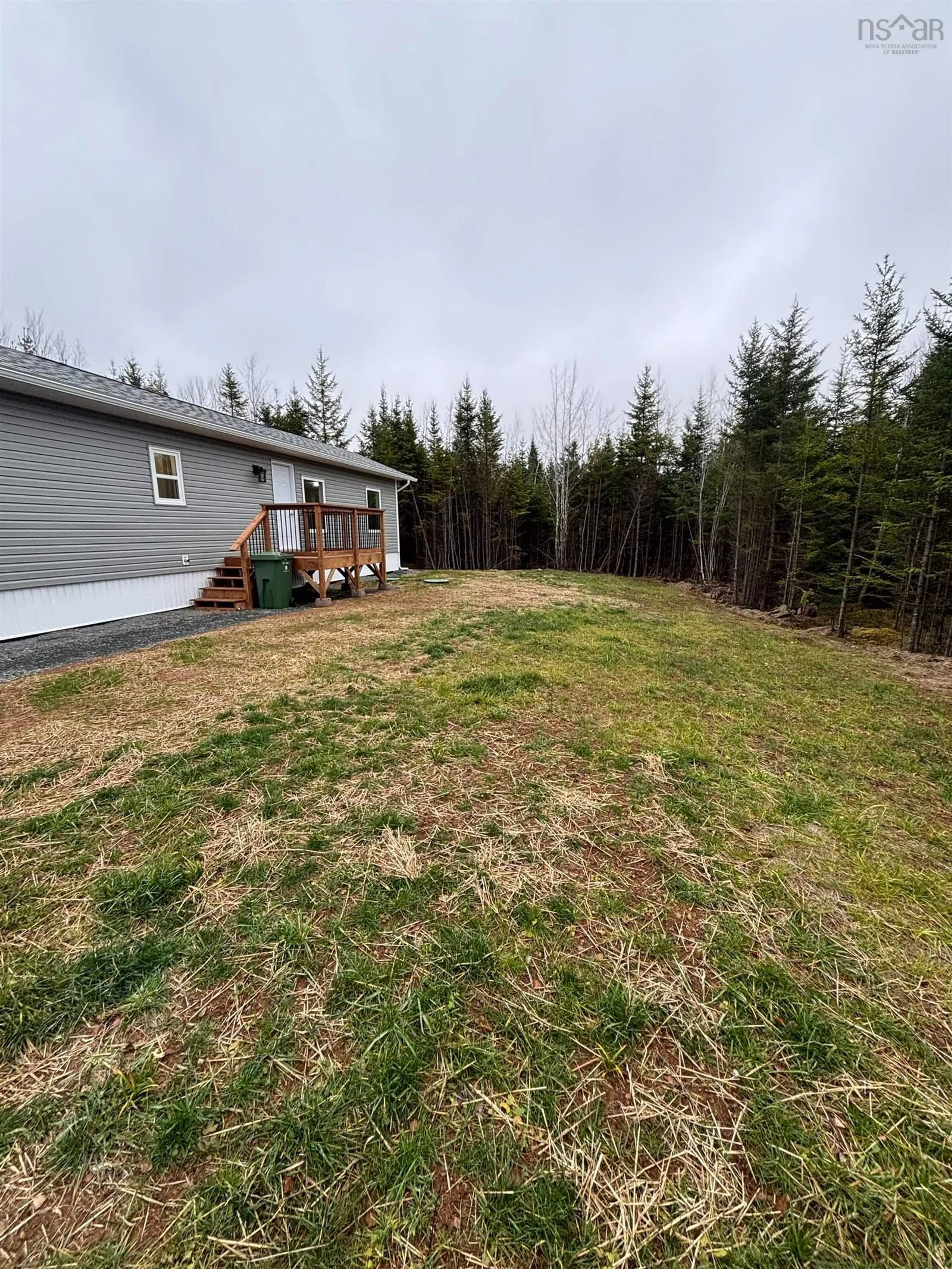 Frontside or backside of a home, the fenced backyard for 38 Maloney Rd, Admiral Rock Nova Scotia B0N 2H0