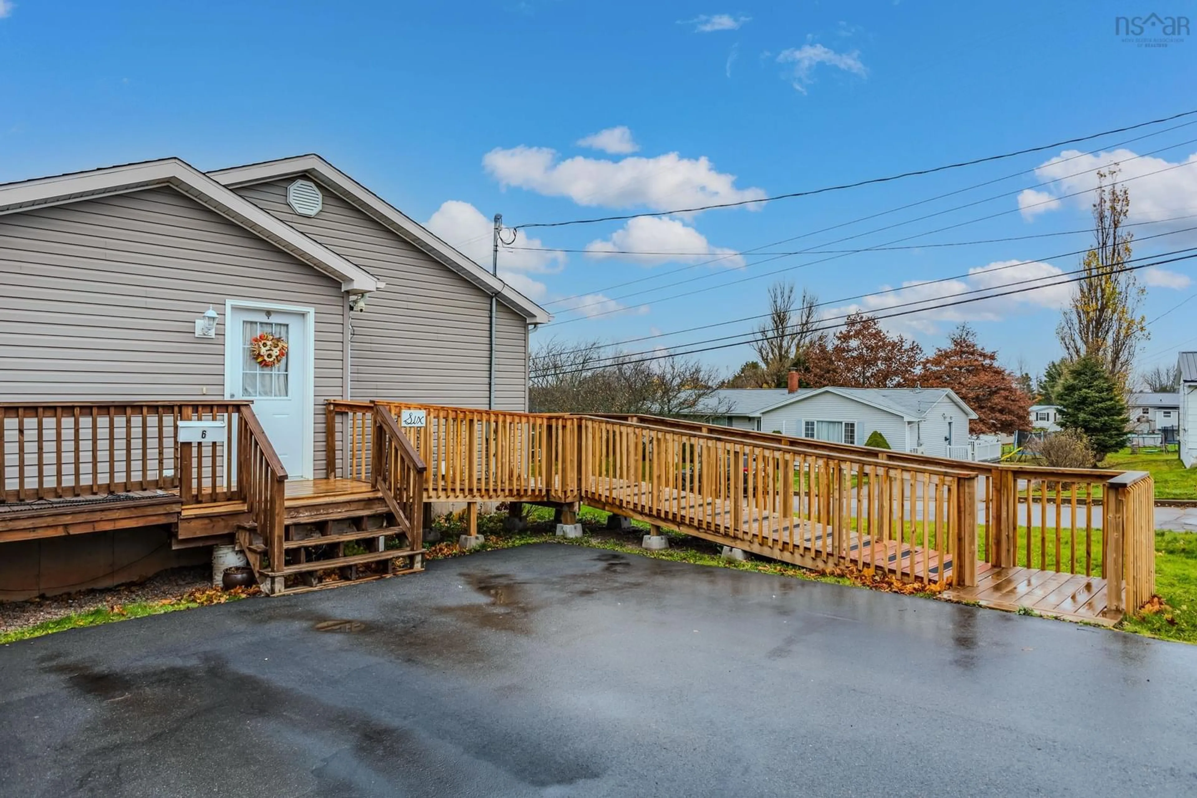 Frontside or backside of a home, the fenced backyard for 6 Senator Ave, Amherst Nova Scotia B4H 2J5