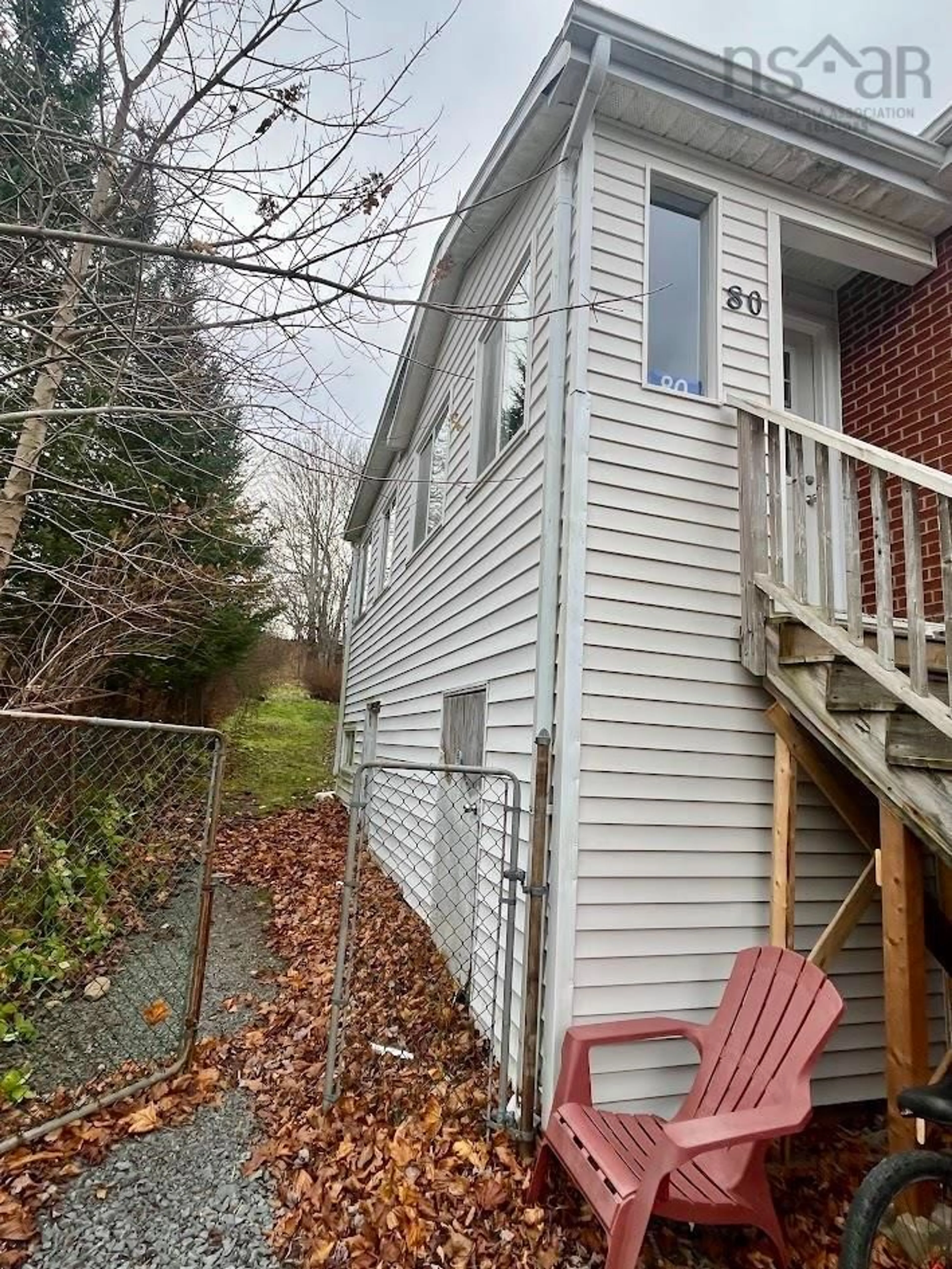 A pic from exterior of the house or condo, the fenced backyard for 80 & 82 Fenwick St, Dartmouth Nova Scotia B2Y 2J6