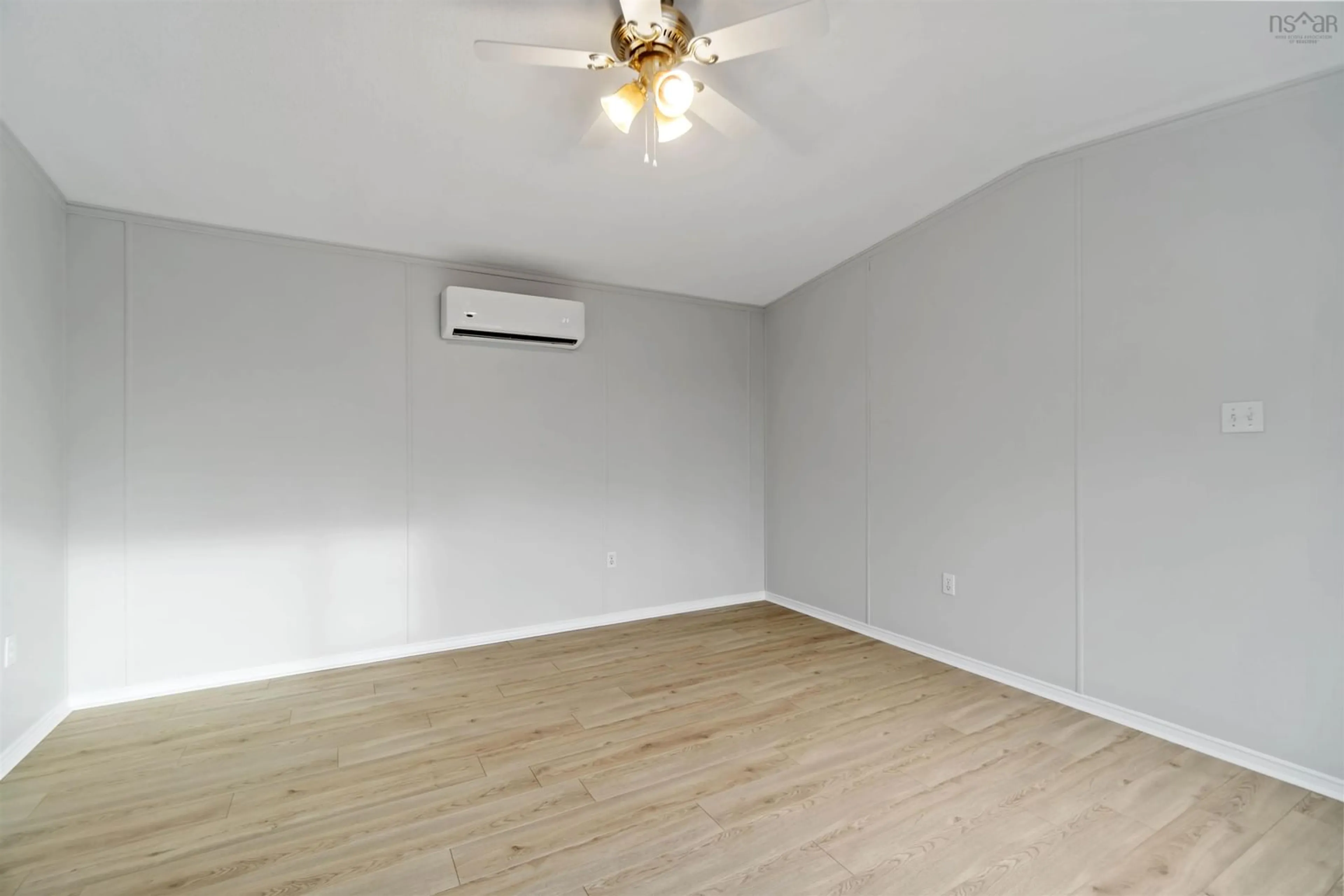 A pic of a room, wood floors for 1 Apple St, Dartmouth Nova Scotia B2W 4W2