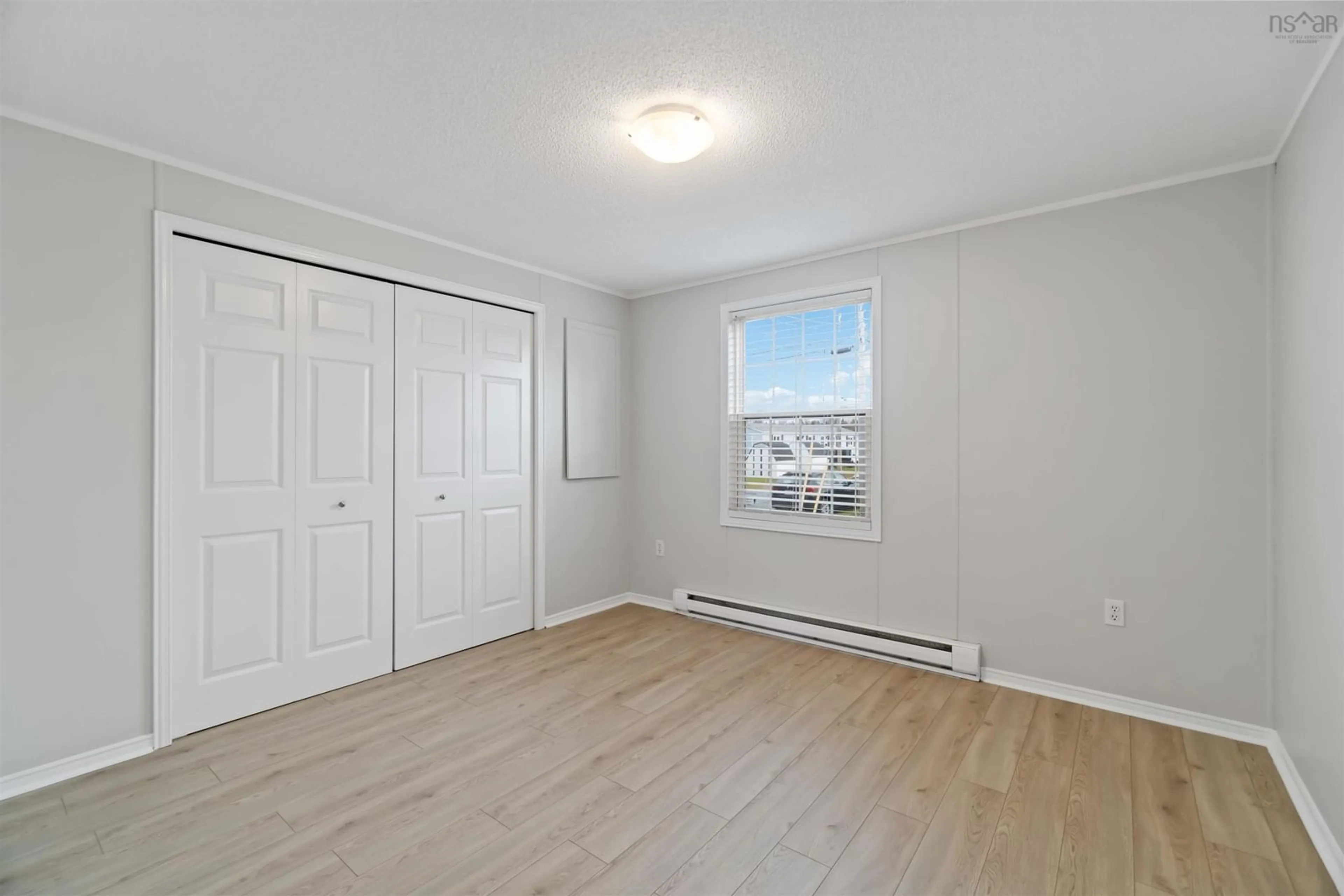 A pic of a room, wood floors for 1 Apple St, Dartmouth Nova Scotia B2W 4W2