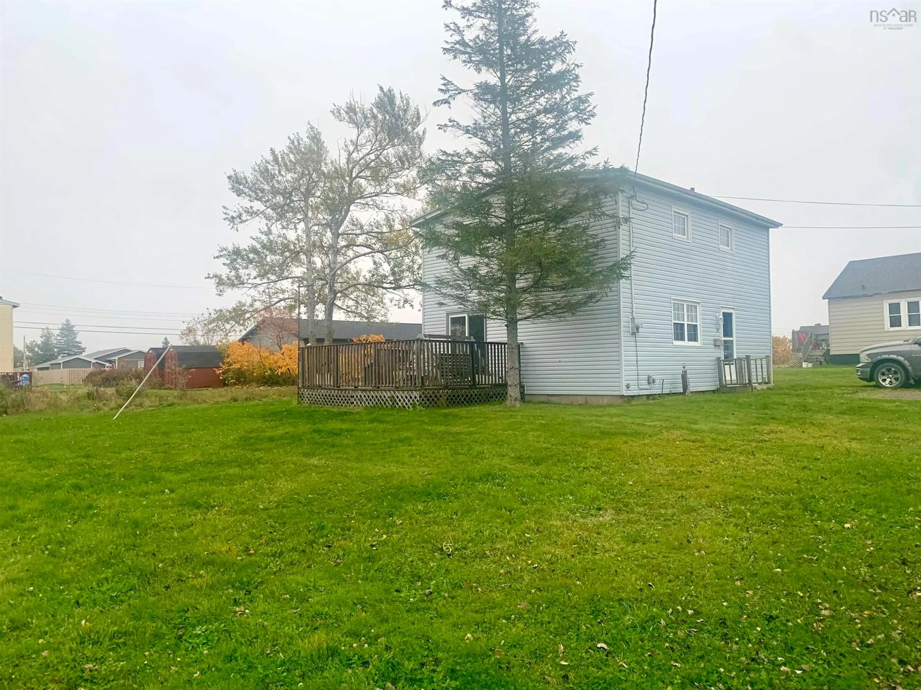 A pic from exterior of the house or condo, the fenced backyard for 29 Boyd St, Glace Bay Nova Scotia B1A 2G5